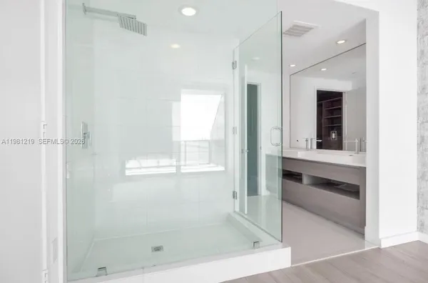 a bathroom with a bathtub and a shower