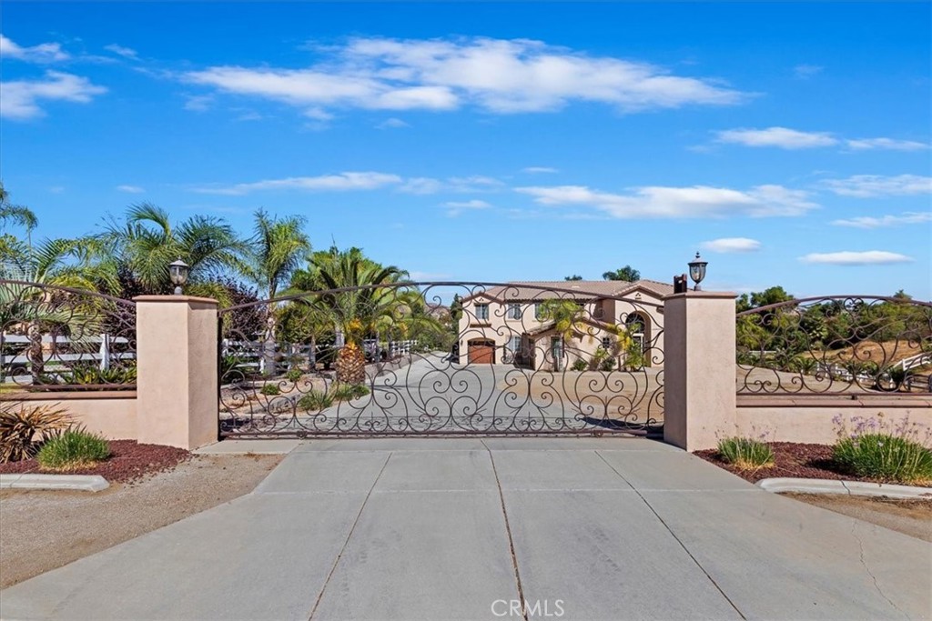 17564 Seven Springs Way Riverside, CA 92504 - Photo 1 of 1 a view of a pathway with a wrought fence