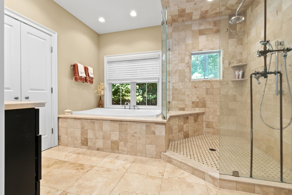 10 Pine Plain Road Georgetown, MA 01833 - Photo 20 of 42 a bathroom with a bathtub and a shower