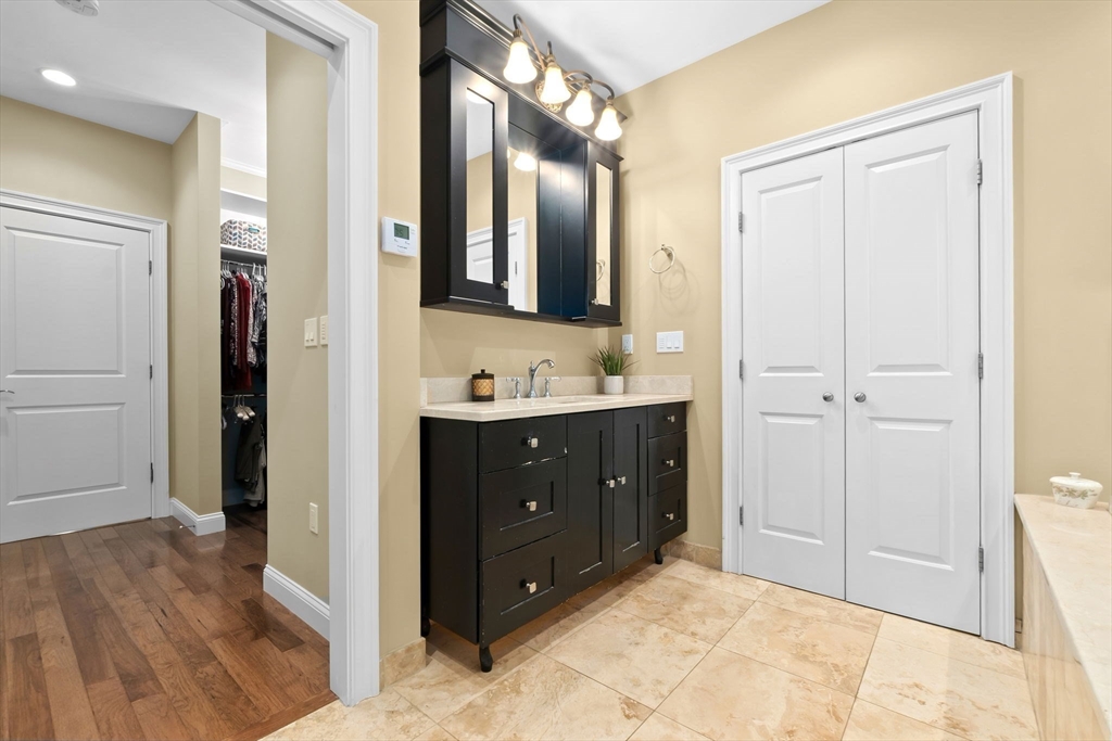 10 Pine Plain Road Georgetown, MA 01833 - Photo 21 of 42 a spacious bathroom with a double vanity sink and a mirror