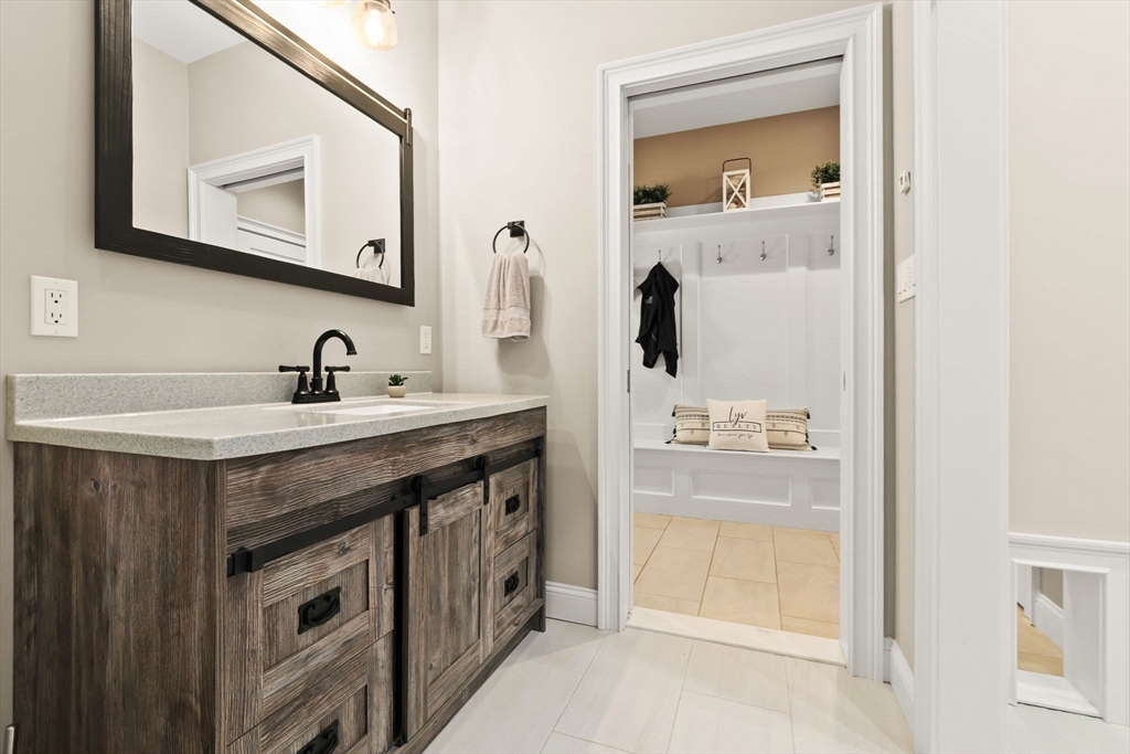 10 Pine Plain Road Georgetown, MA 01833 - Photo 27 of 42 a bathroom with a sink a vanity and a mirror