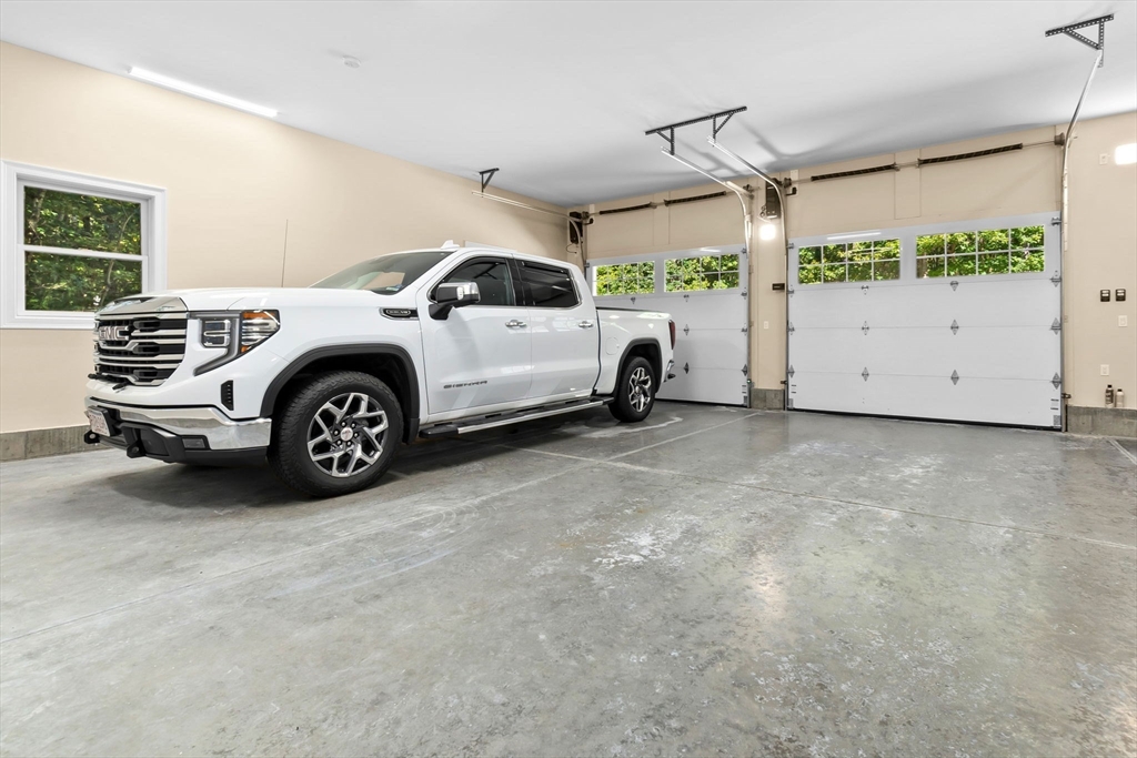 10 Pine Plain Road Georgetown, MA 01833 - Photo 36 of 42 a view of a garage and car parked