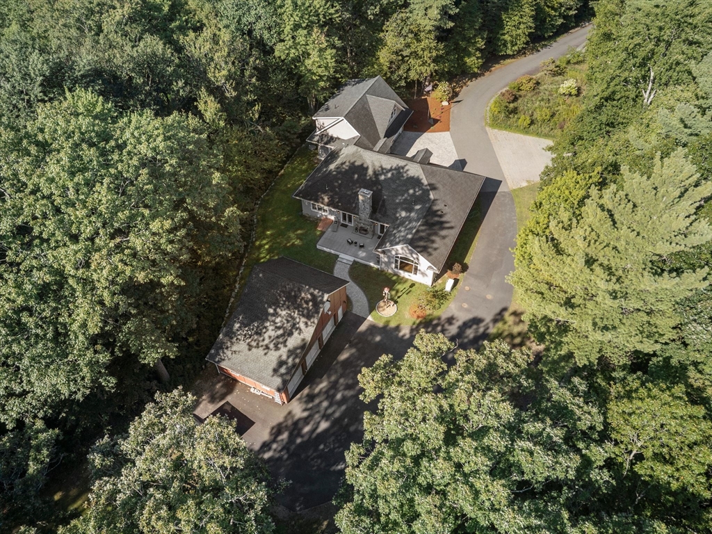 10 Pine Plain Road Georgetown, MA 01833 - Photo 42 of 42 an aerial view of a house with a yard and large trees