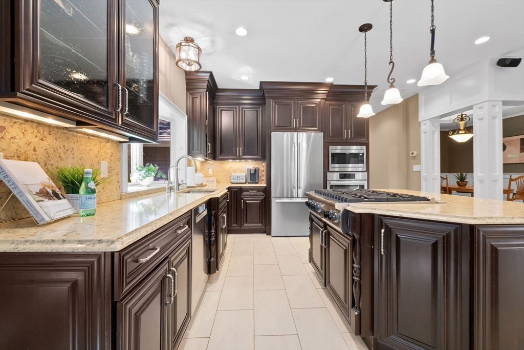 10 Pine Plain Road Georgetown, MA 01833 - Photo 6 of 42 a kitchen with stainless steel appliances granite countertop a sink and a refrigerator