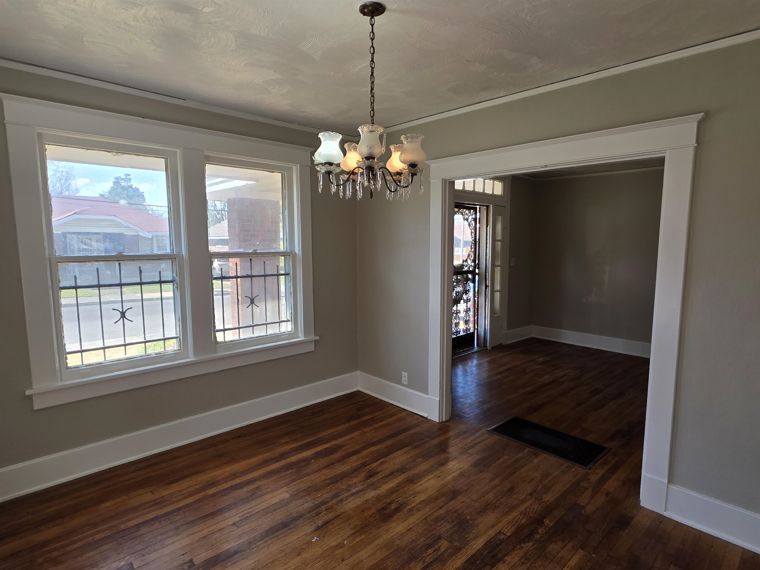 1404 Cameron Street Memphis, TN 38106 - Photo 13 of 37 a view of a room with wooden floor chandelier and entryway