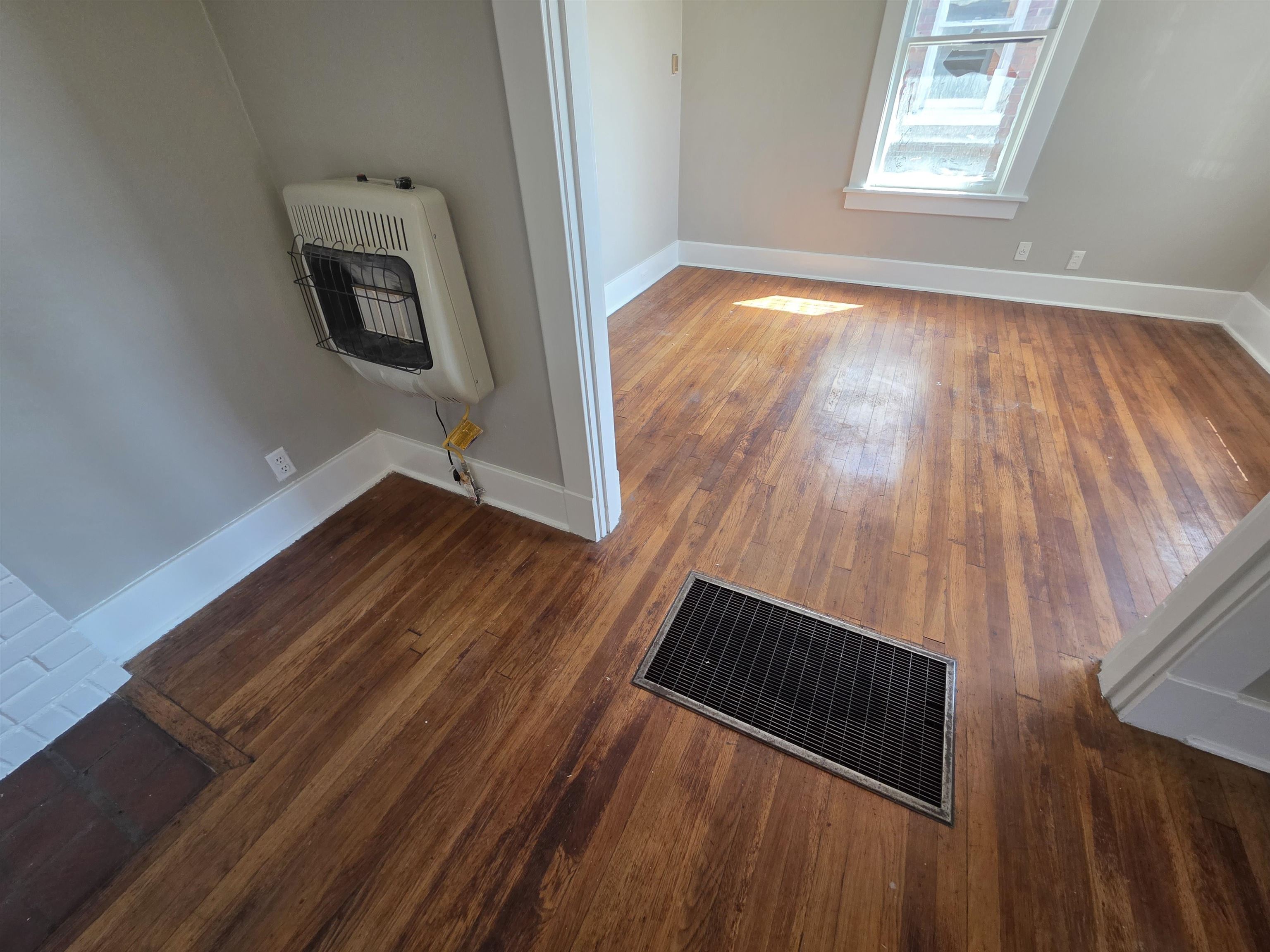 1404 Cameron Street Memphis, TN 38106 - Photo 17 of 37 a view of an empty room and wooden floor