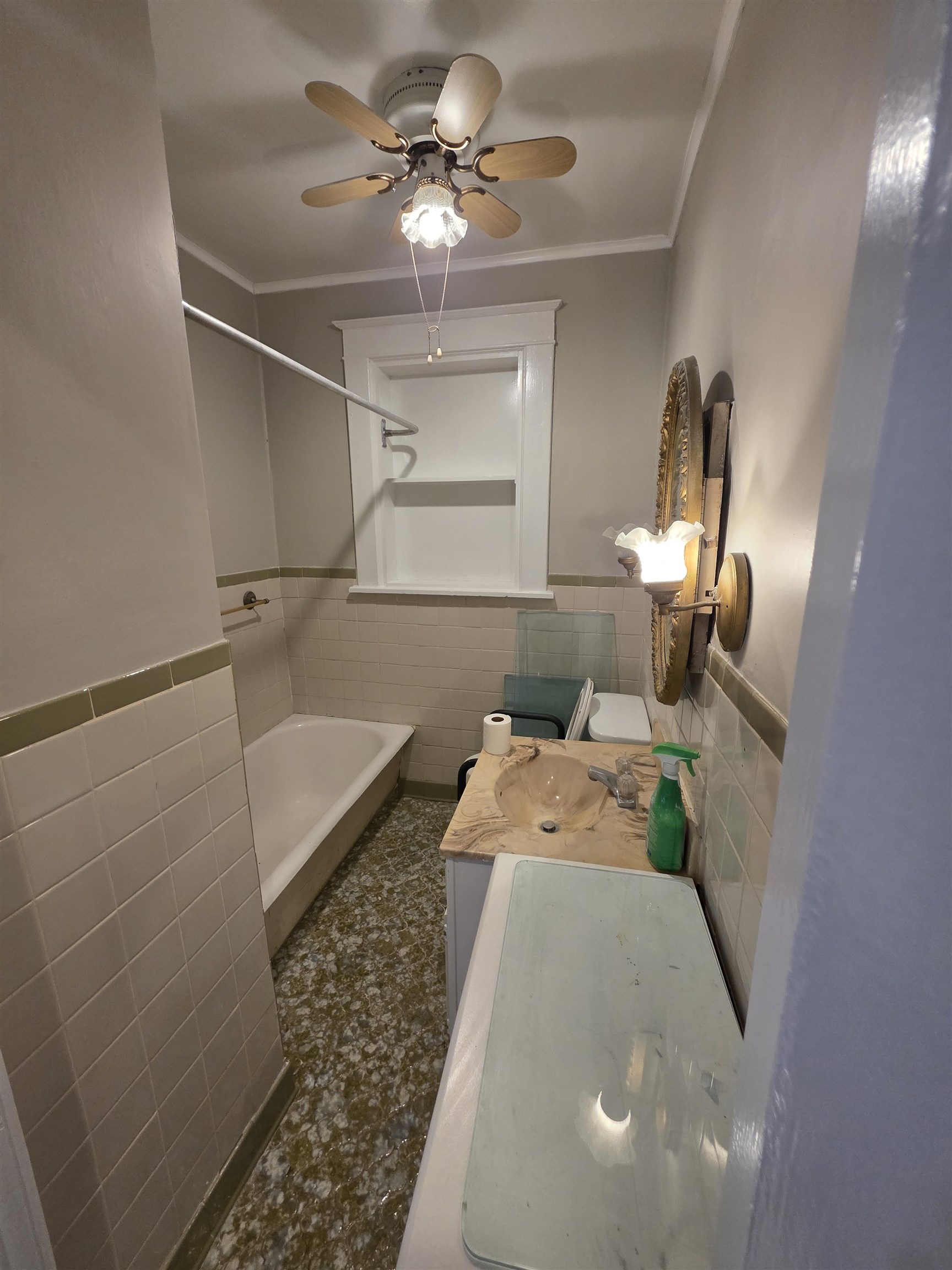 1404 Cameron Street Memphis, TN 38106 - Photo 24 of 37 a bedroom with a bed and a chandelier
