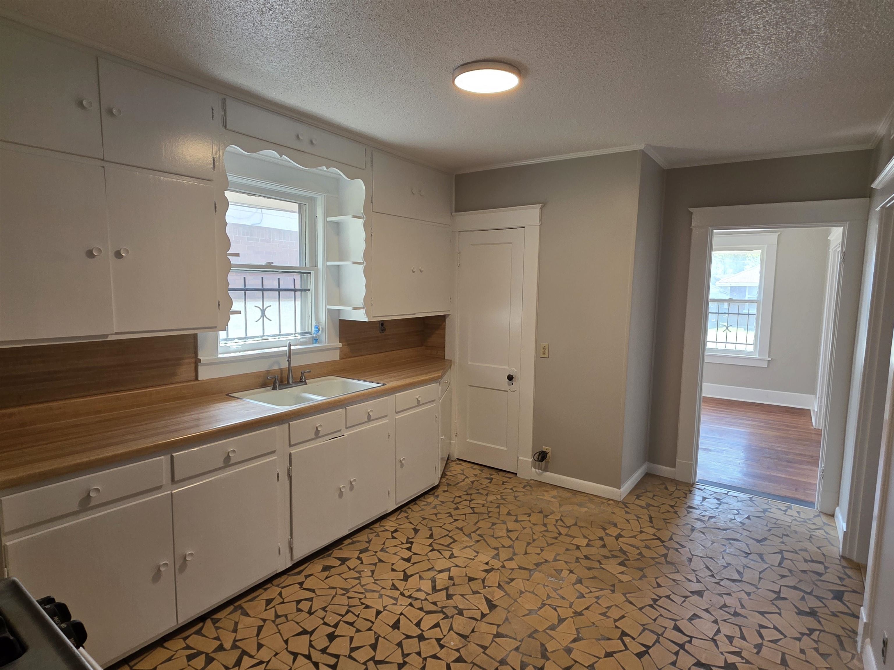 1404 Cameron Street Memphis, TN 38106 - Photo 33 of 37 a kitchen with sink and cabinets
