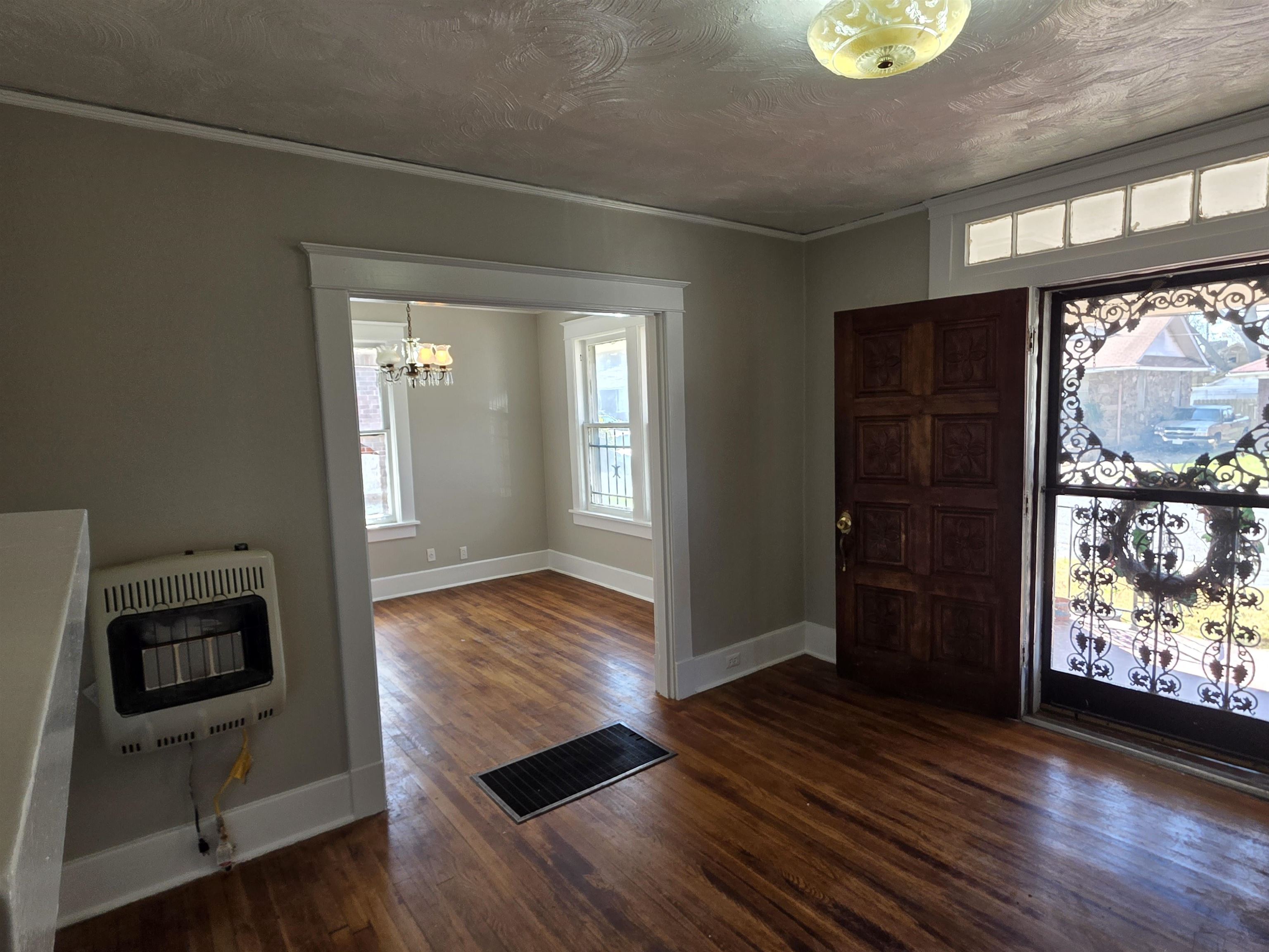 1404 Cameron Street Memphis, TN 38106 - Photo 34 of 37 a view of an empty room with wooden floor and a window