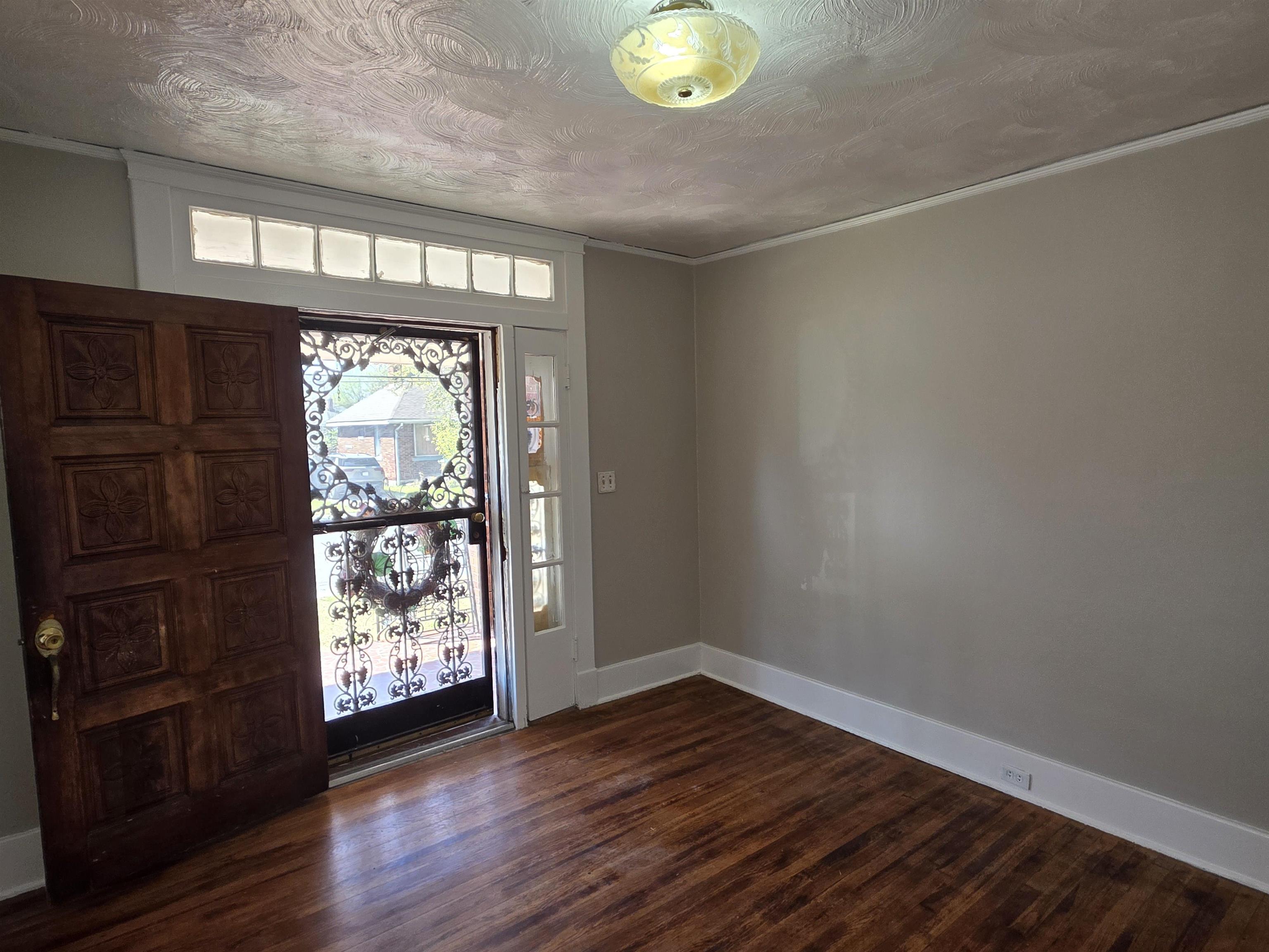 1404 Cameron Street Memphis, TN 38106 - Photo 35 of 37 an empty room with wooden floor and windows