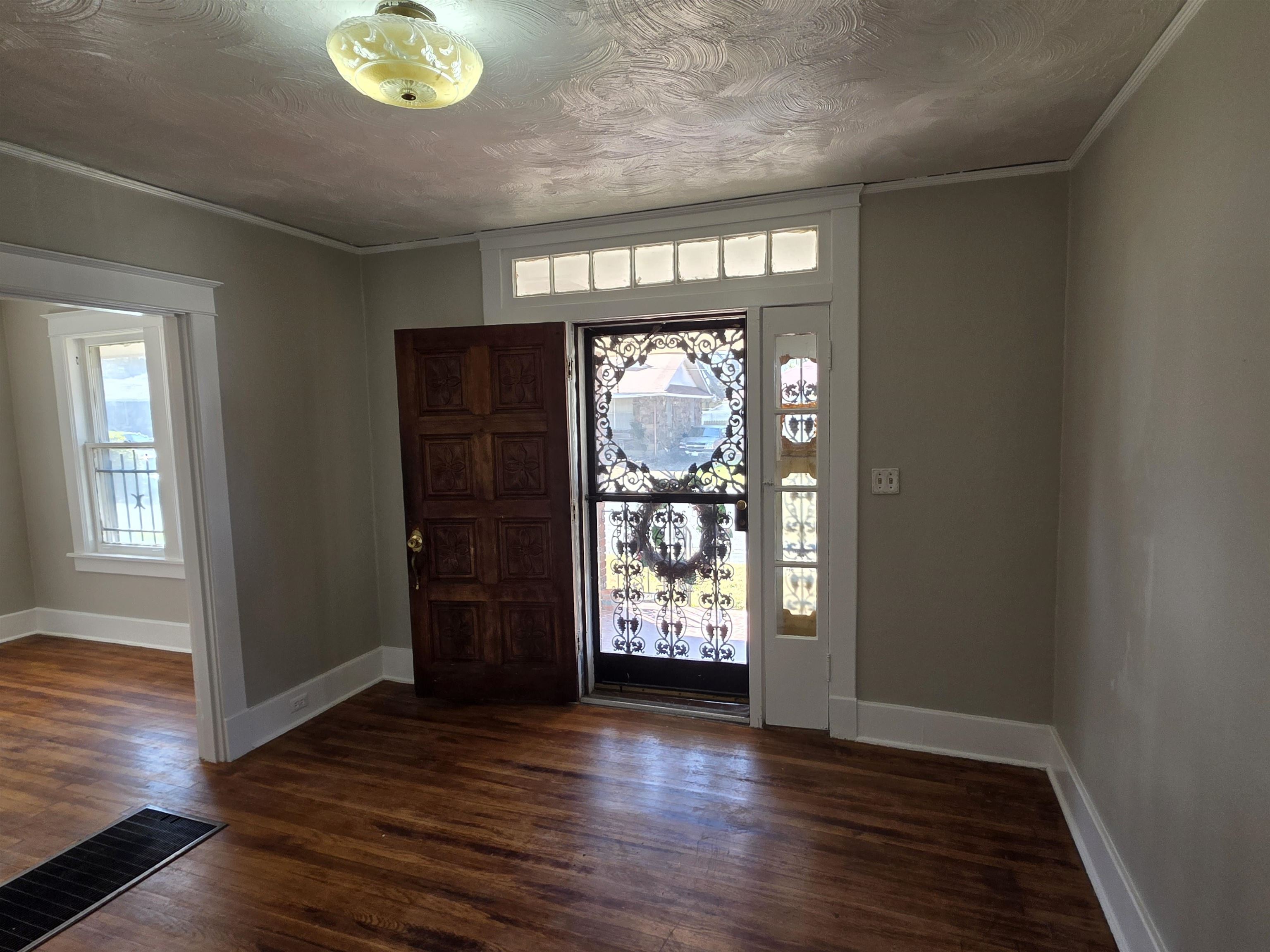 1404 Cameron Street Memphis, TN 38106 - Photo 36 of 37 an empty room with wooden floor and windows