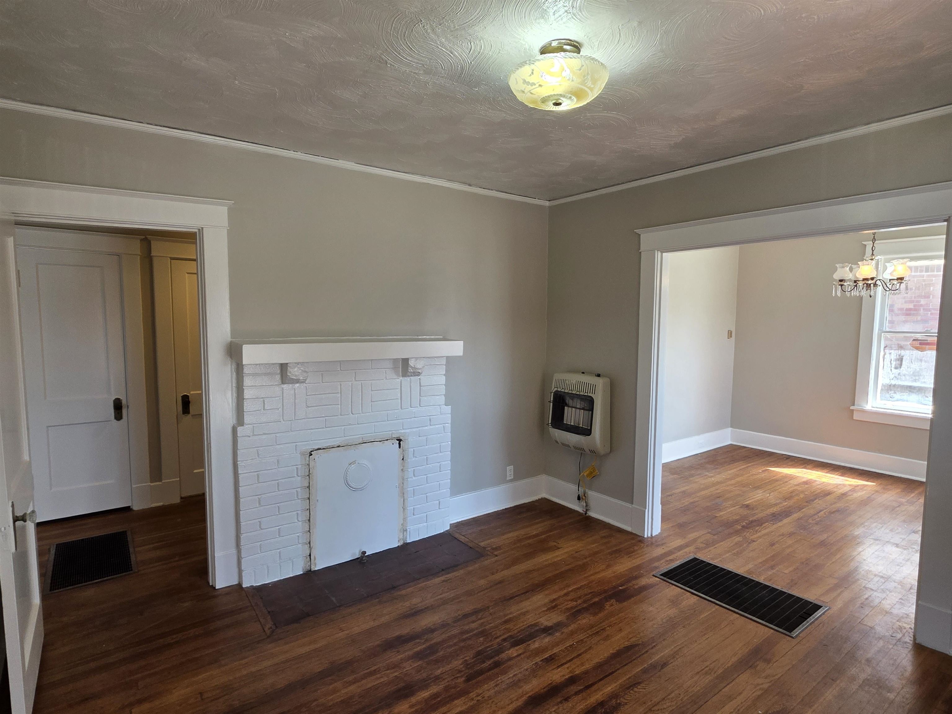 1404 Cameron Street Memphis, TN 38106 - Photo 37 of 37 an empty room with wooden floor and windows