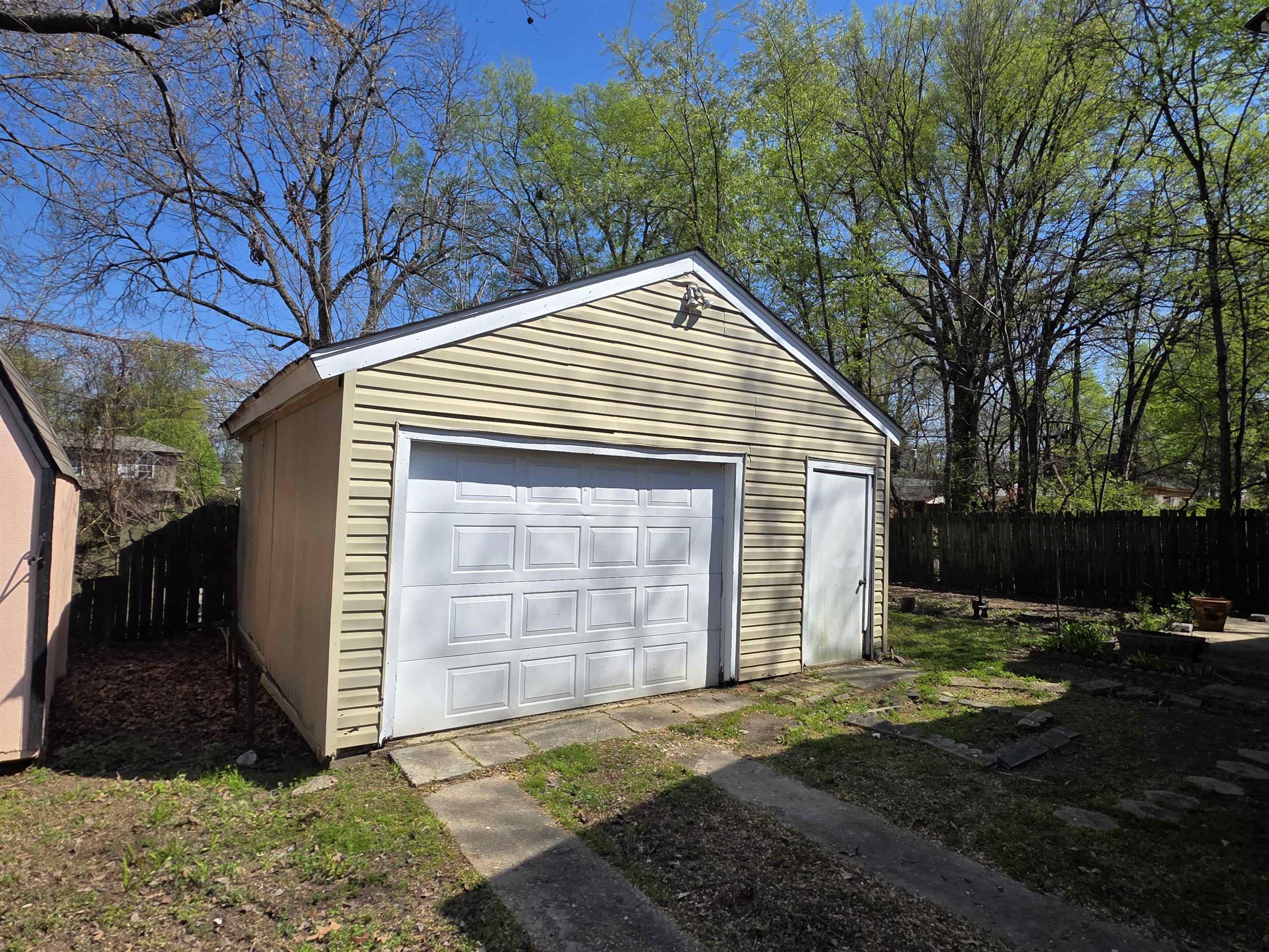 1404 Cameron Street Memphis, TN 38106 - Photo 6 of 37 a front view of a house with a yard and garage