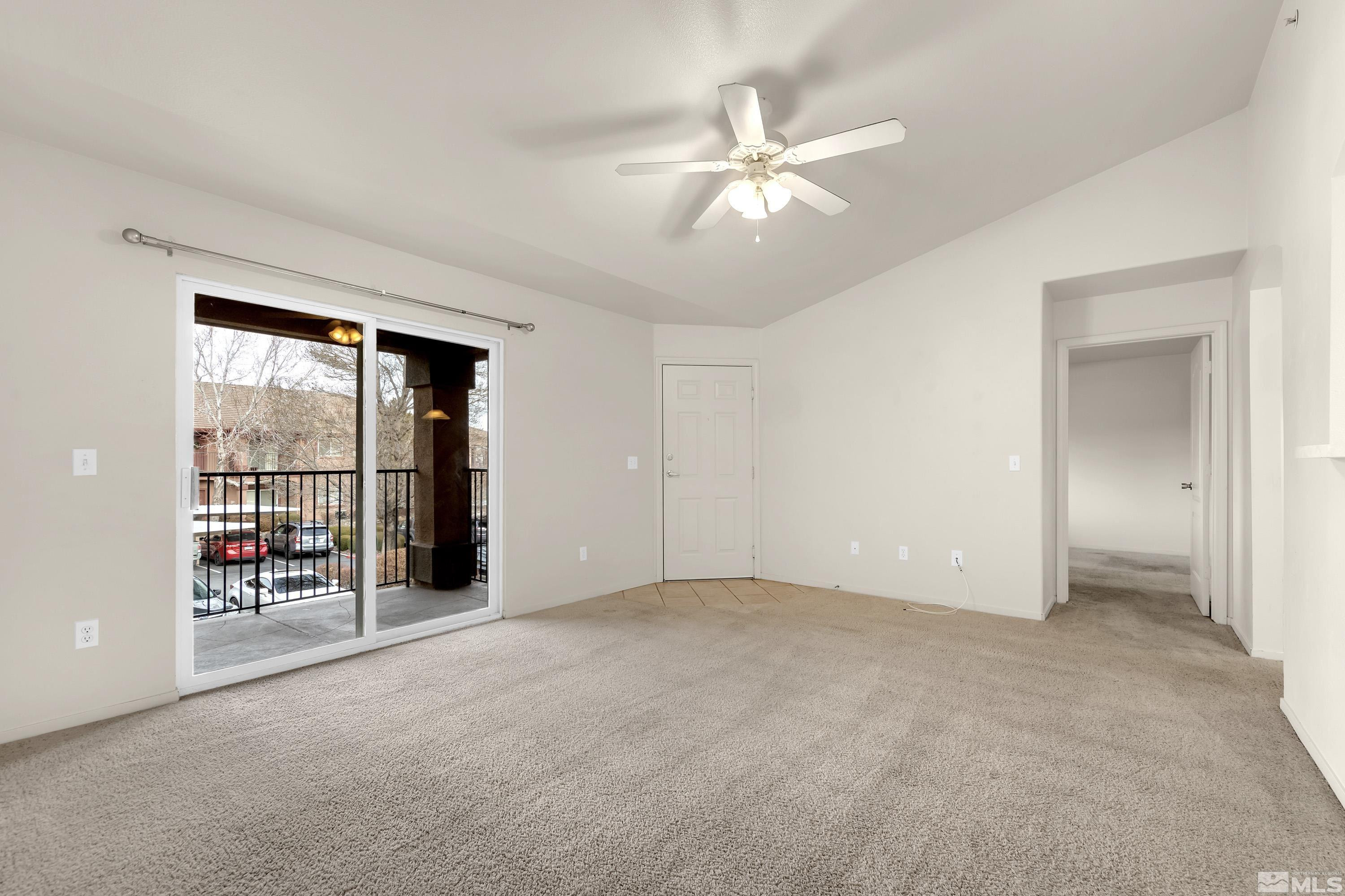 6850 Sharlands Avenue, Unit 2120 Reno, NV 89523 - Photo 11 of 35 an empty room with fan and windows