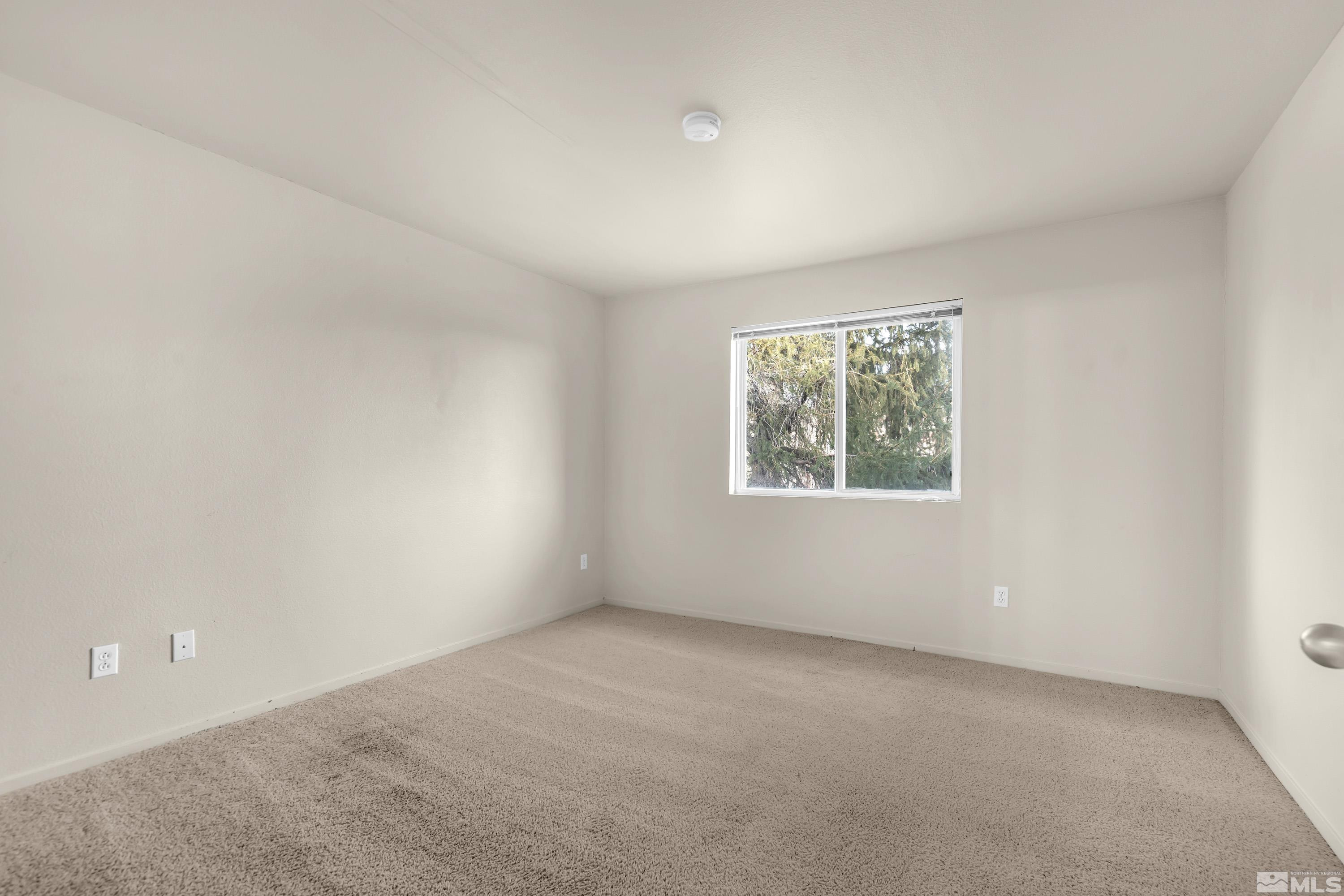 6850 Sharlands Avenue, Unit 2120 Reno, NV 89523 - Photo 17 of 35 an empty room with windows