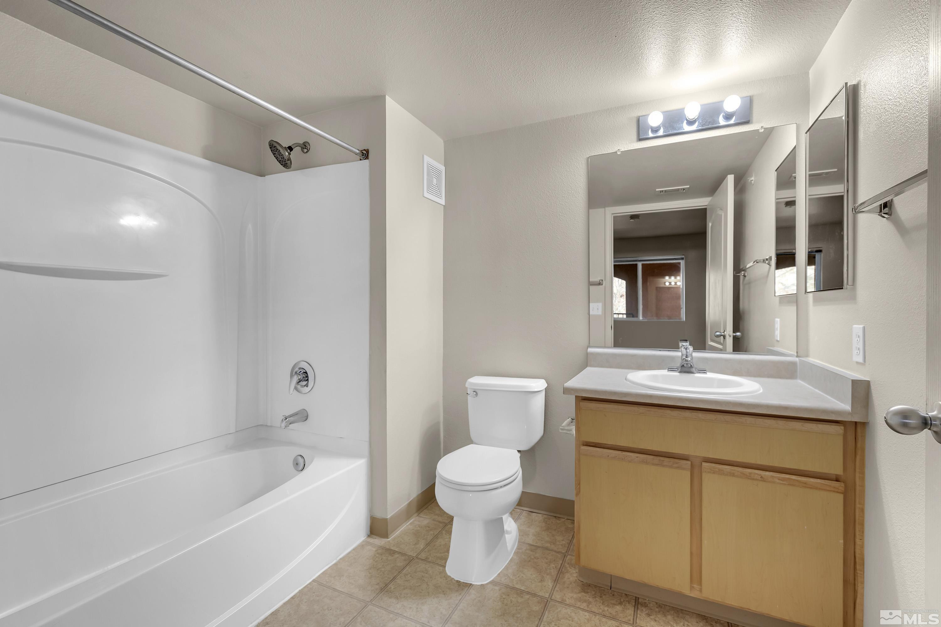 6850 Sharlands Avenue, Unit 2120 Reno, NV 89523 - Photo 19 of 35 a bathroom with a sink toilet tub and vanity