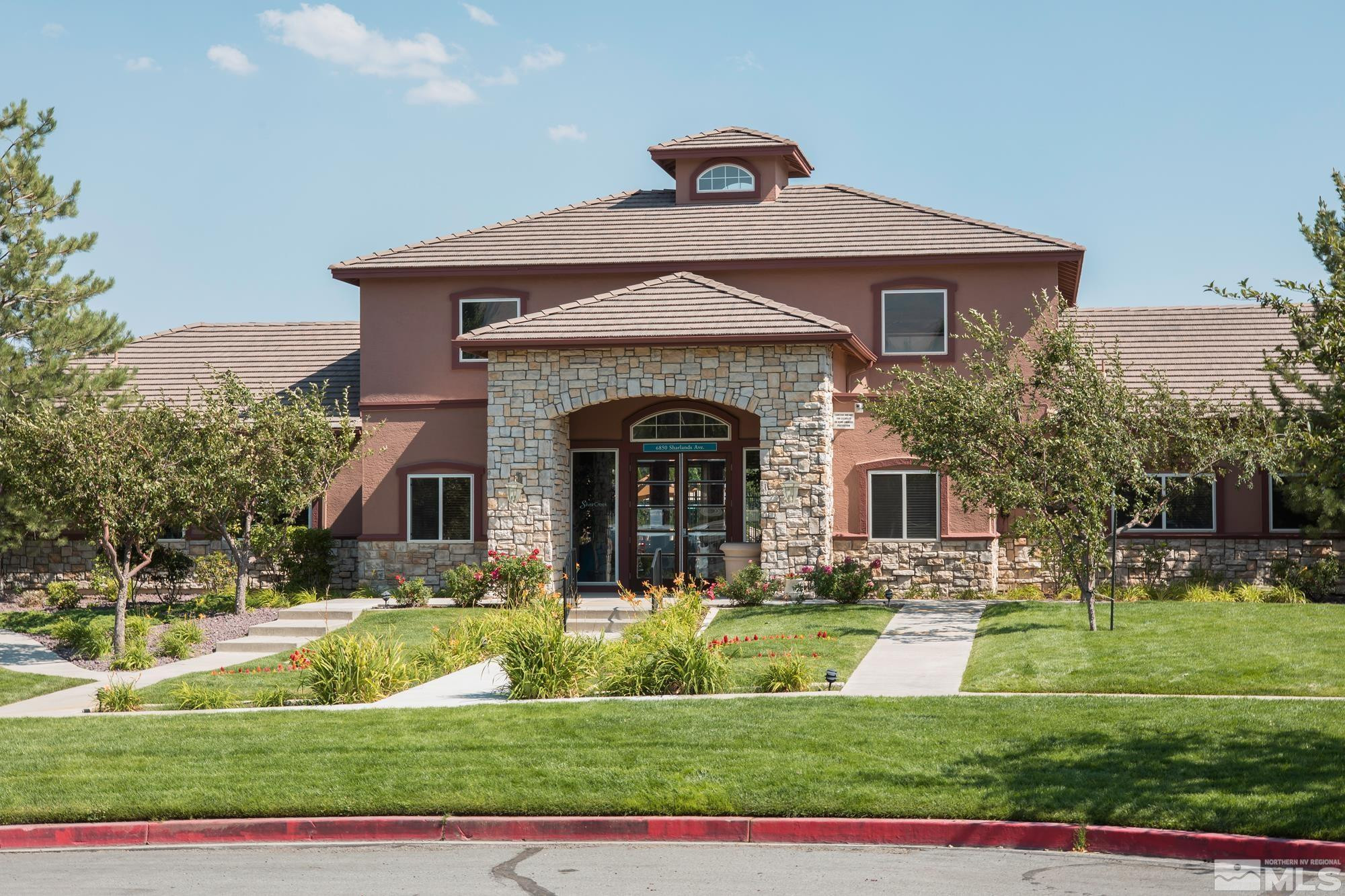 6850 Sharlands Avenue, Unit 2120 Reno, NV 89523 - Photo 23 of 35 a front view of a house with a yard