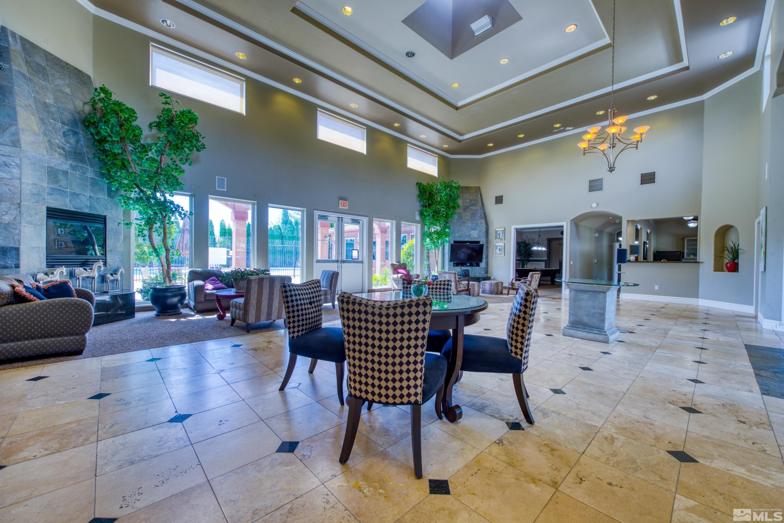 6850 Sharlands Avenue, Unit 2120 Reno, NV 89523 - Photo 28 of 35 a living room with furniture and a potted plant