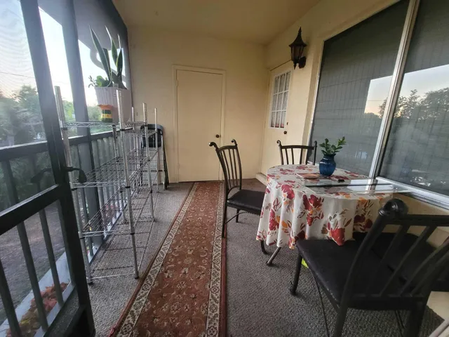a view of an chairs and table in the balcony