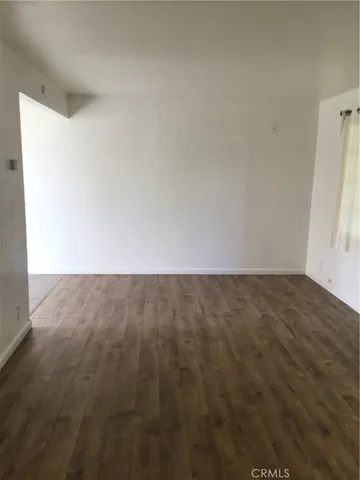 a kitchen with granite countertop white cabinets and stainless steel appliances