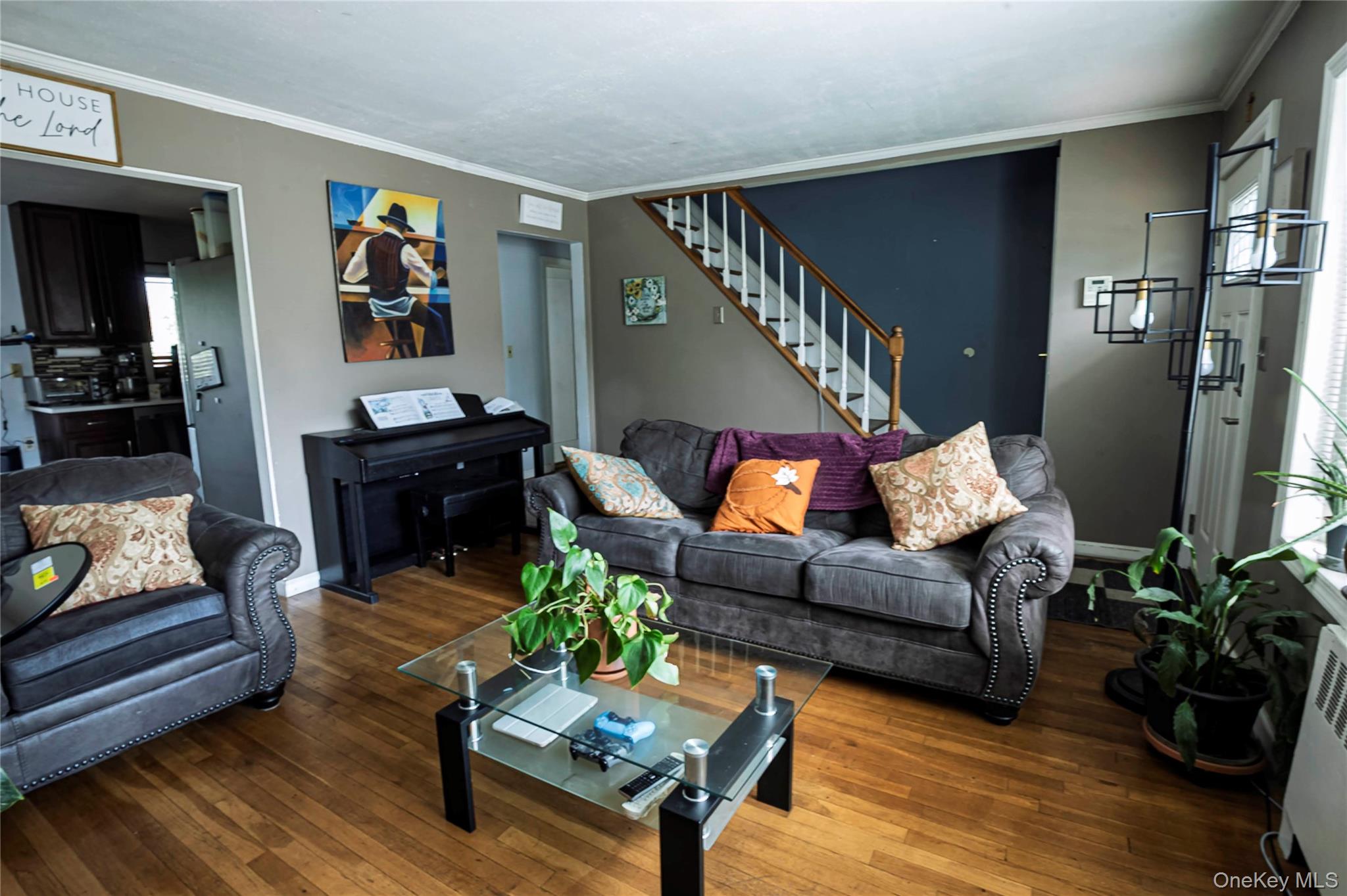 2687 Fox Road Baldwin, NY 11510 - Photo 11 of 27 a living room with furniture and a potted plant