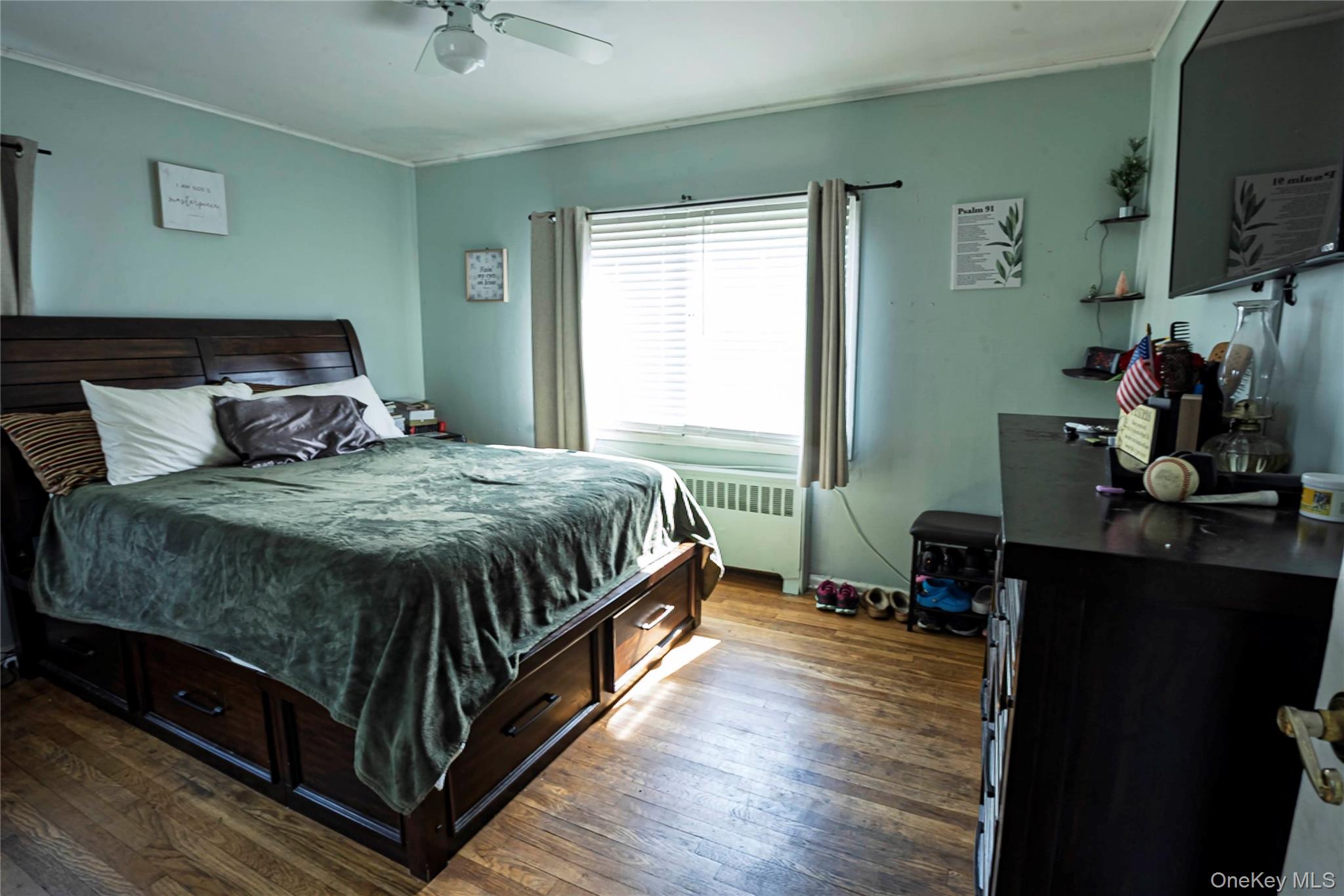 2687 Fox Road Baldwin, NY 11510 - Photo 15 of 27 a bedroom with a bed and a flat tv screen on dresser