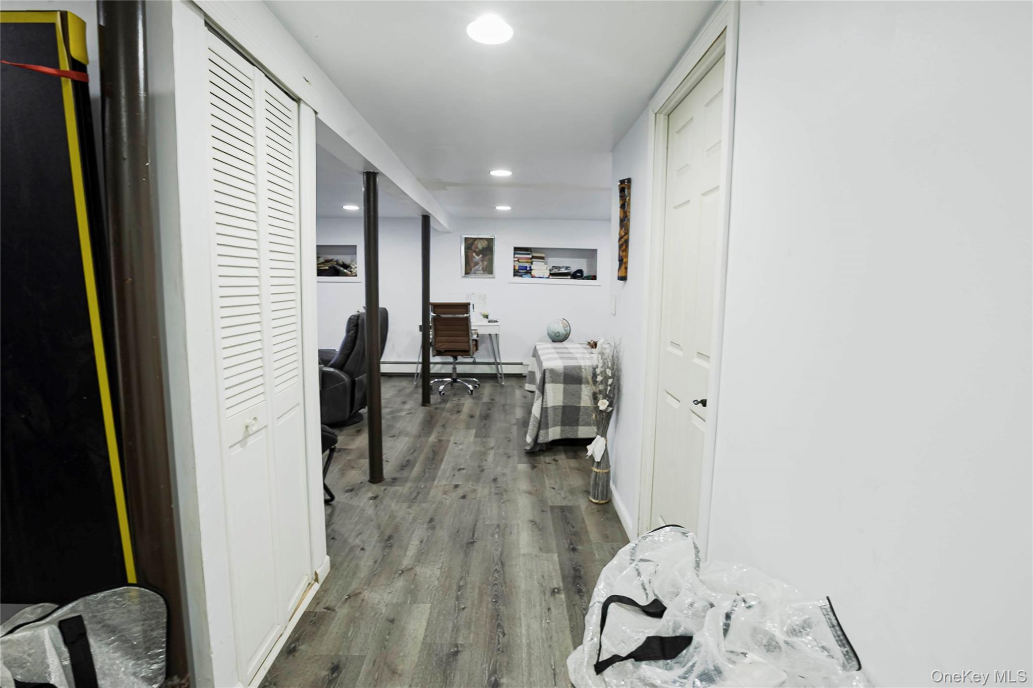 2687 Fox Road Baldwin, NY 11510 - Photo 23 of 27 a very nice looking room with a wooden floor