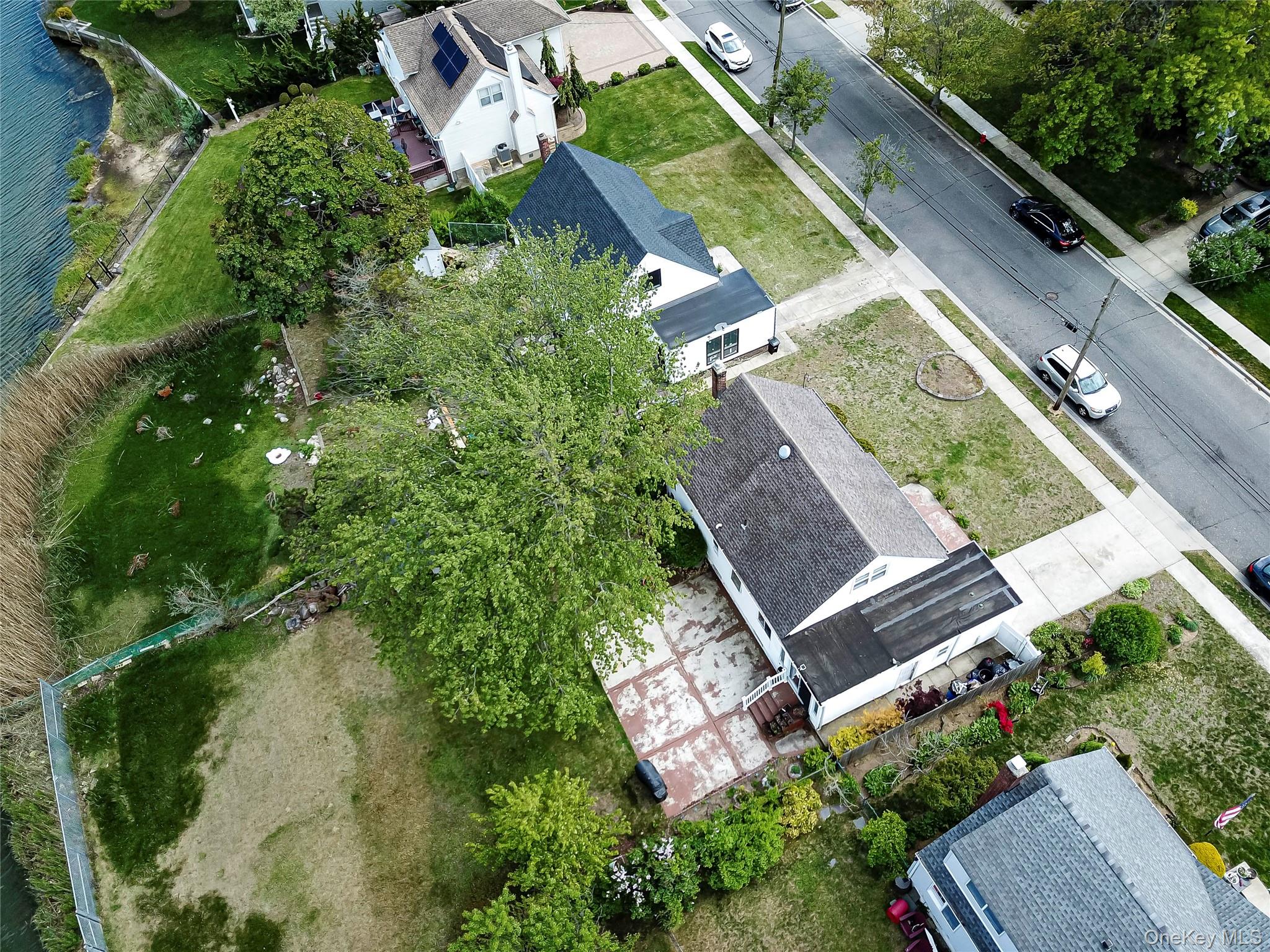 2687 Fox Road Baldwin, NY 11510 - Photo 3 of 27 an aerial view of a house with a garden