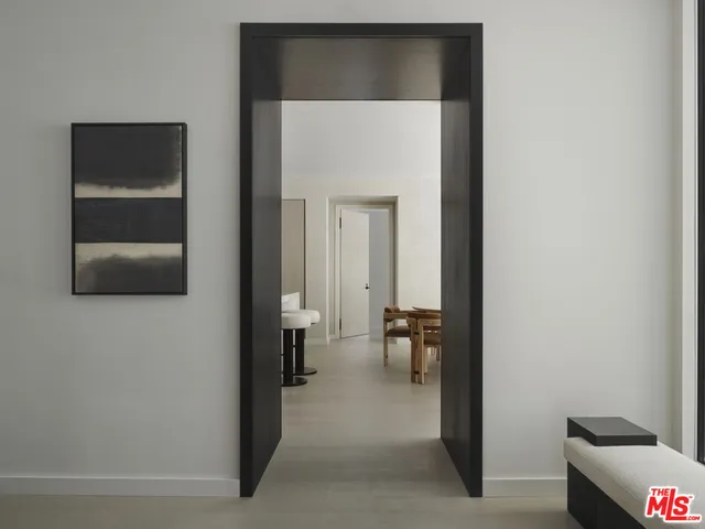 a view of a hallway with seating area