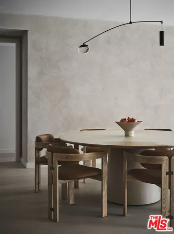 a room with a table and chairs