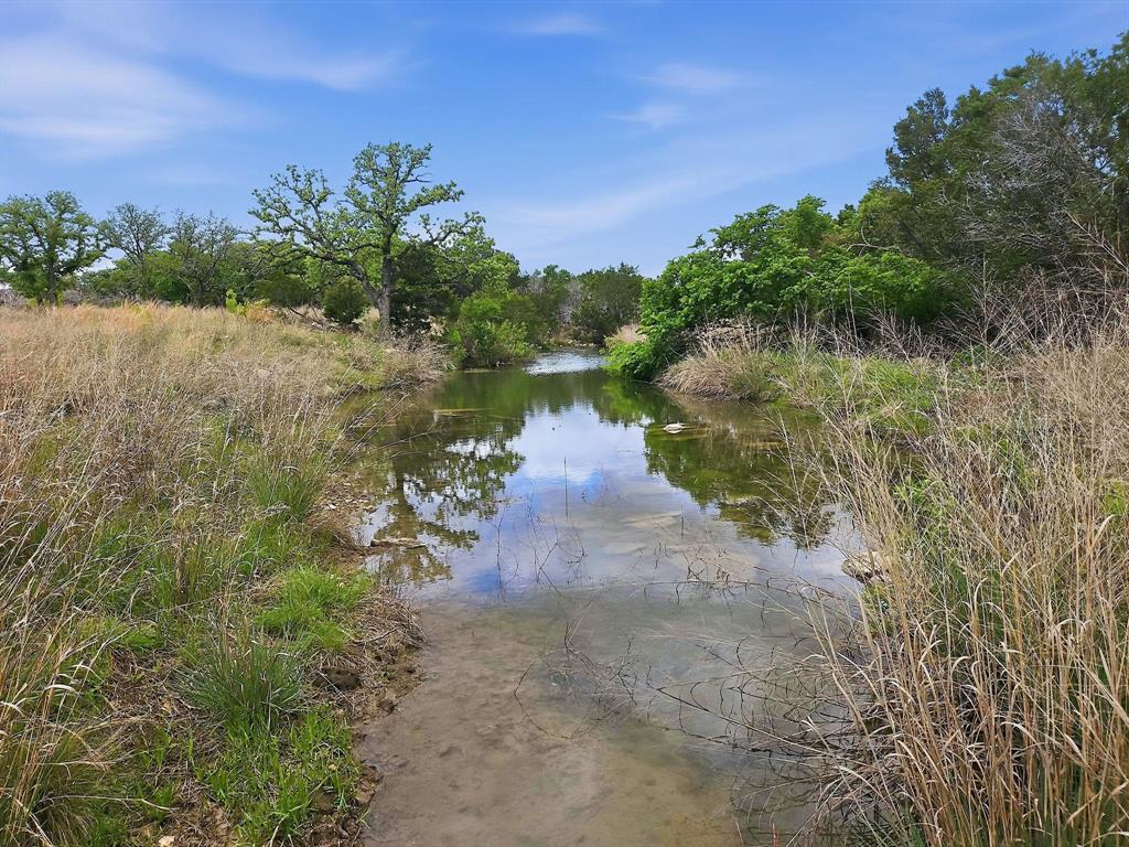 Lot 73-74 Lot Evant, TX 76525 - Photo 1 of 31 a view of a lake with houses in the back