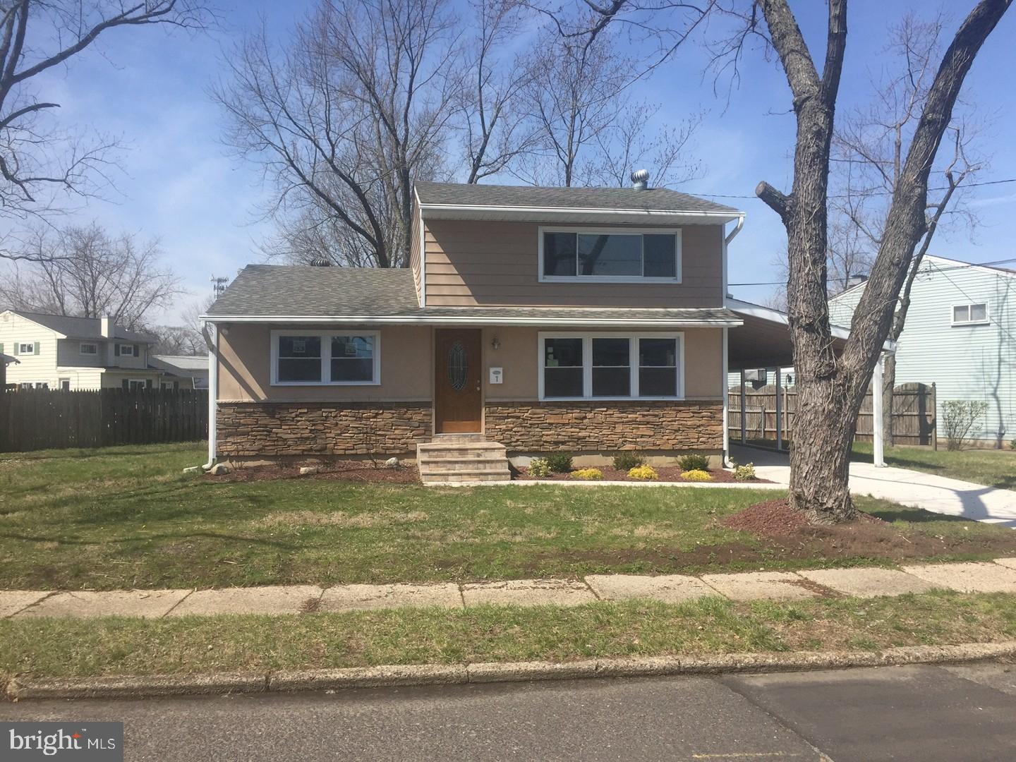 7 East Roland Avenue Maple Shade, NJ 08052 - Photo 1 of 6 a front view of a house with a garden