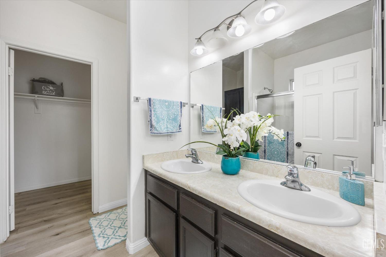 Undisclosed Address Bakersfield, CA 93307 - Photo 20 of 35 a bathroom with a sink and a mirror
