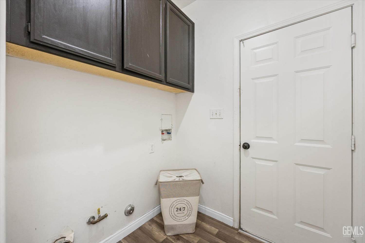 Undisclosed Address Bakersfield, CA 93307 - Photo 23 of 35 a view of a storage & utility room with dryer and washer