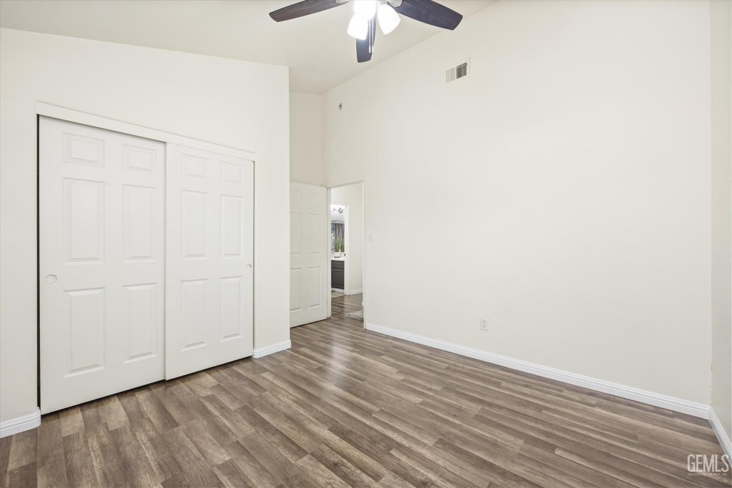 Undisclosed Address Bakersfield, CA 93307 - Photo 27 of 35 a view of an empty room with wooden floor