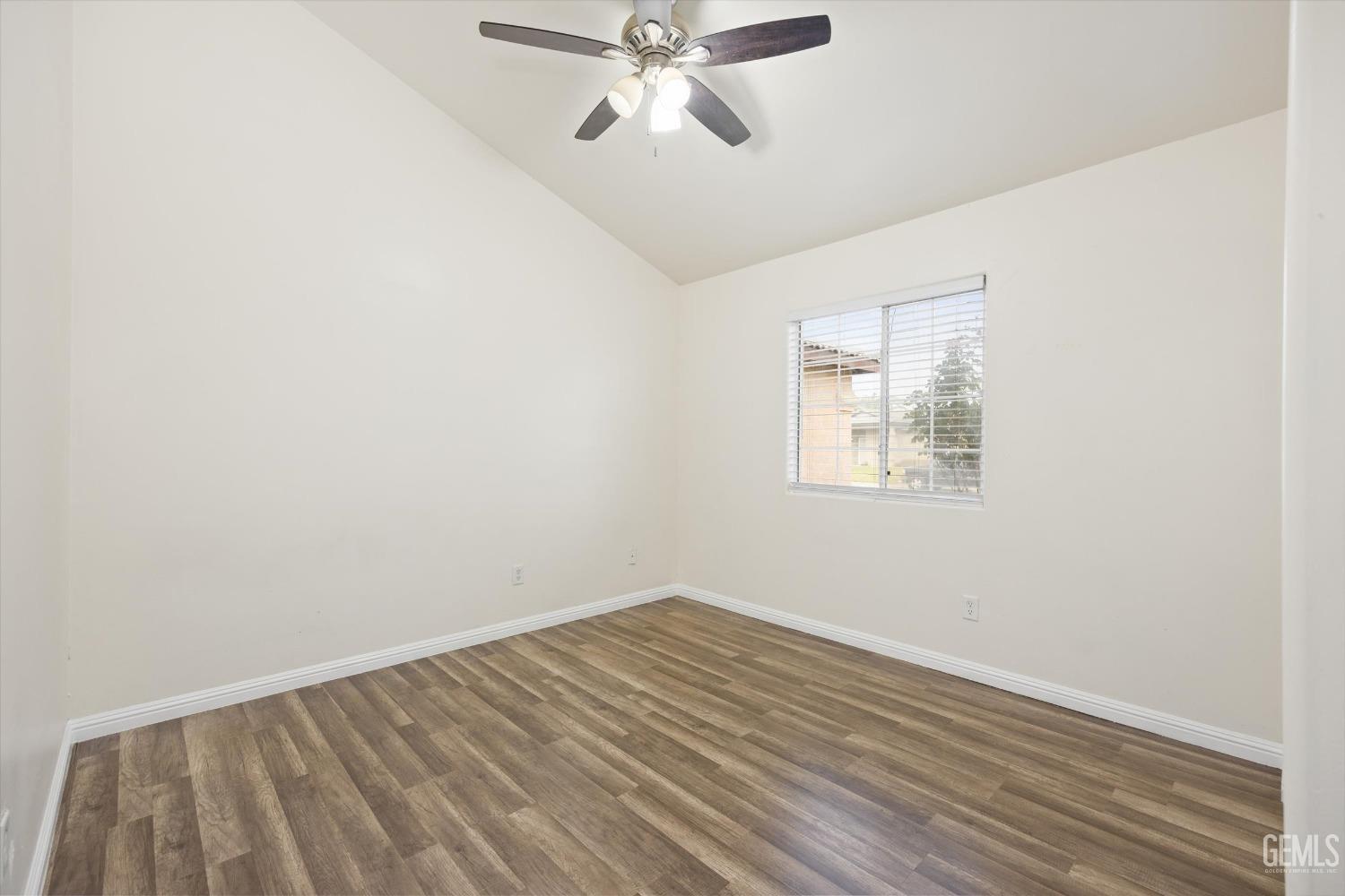 Undisclosed Address Bakersfield, CA 93307 - Photo 28 of 35 an empty room with a window and a ceiling fan
