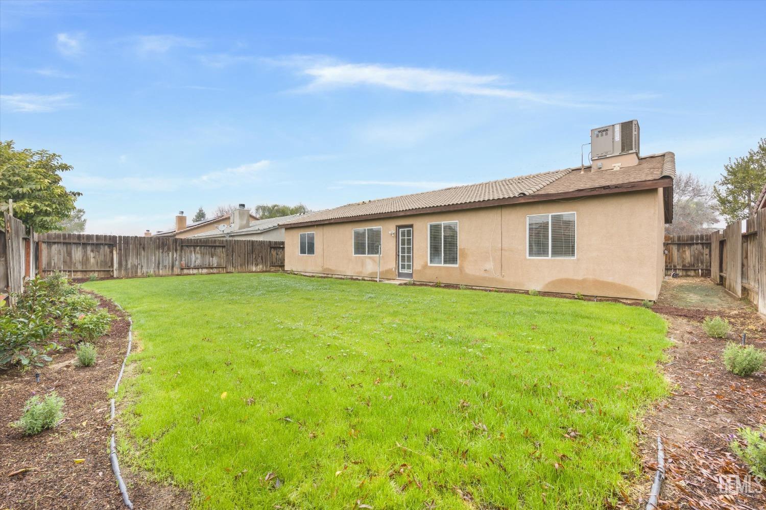 Undisclosed Address Bakersfield, CA 93307 - Photo 30 of 35 a view of a house with backyard and garden