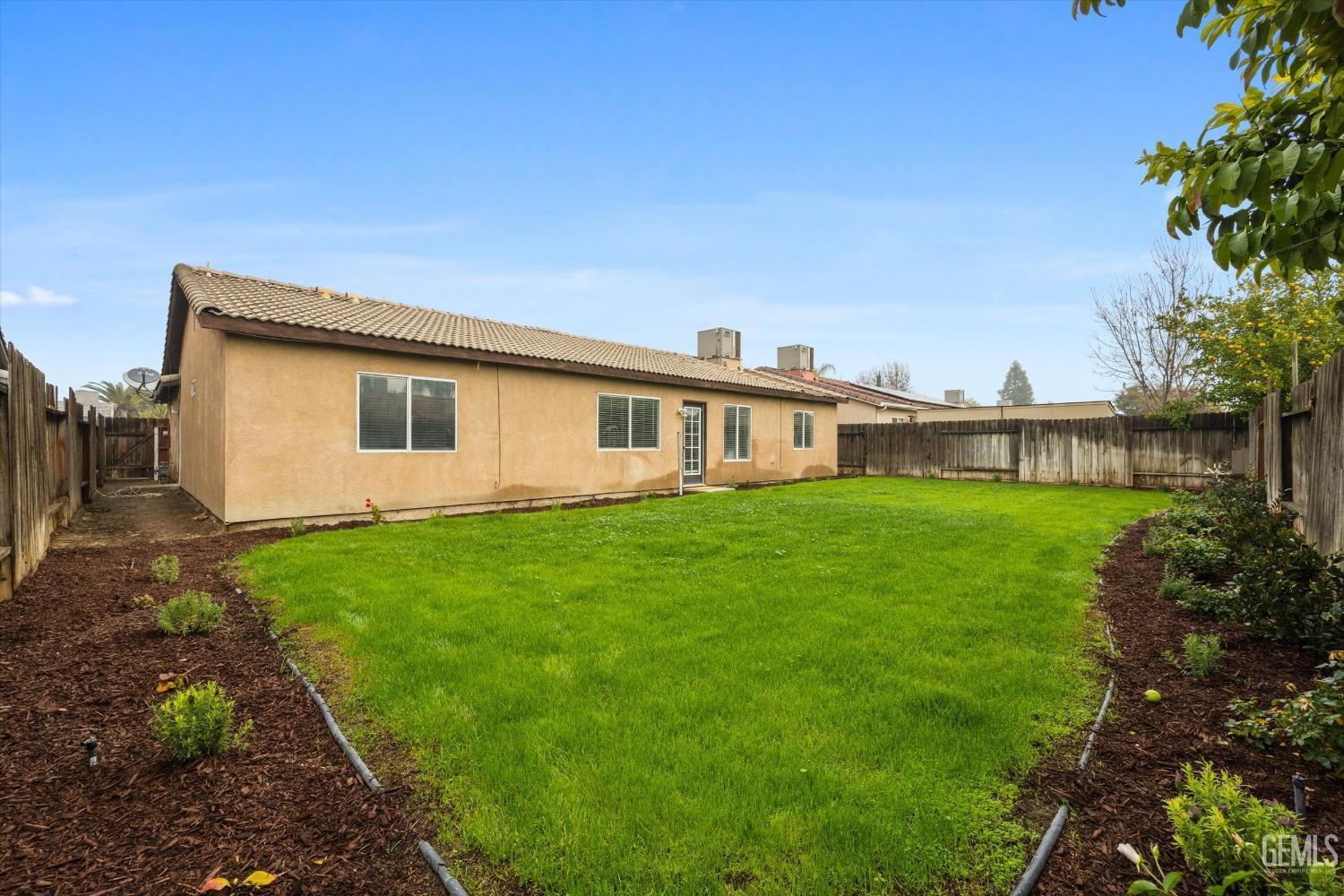 Undisclosed Address Bakersfield, CA 93307 - Photo 31 of 35 a view of an house with backyard space and garden