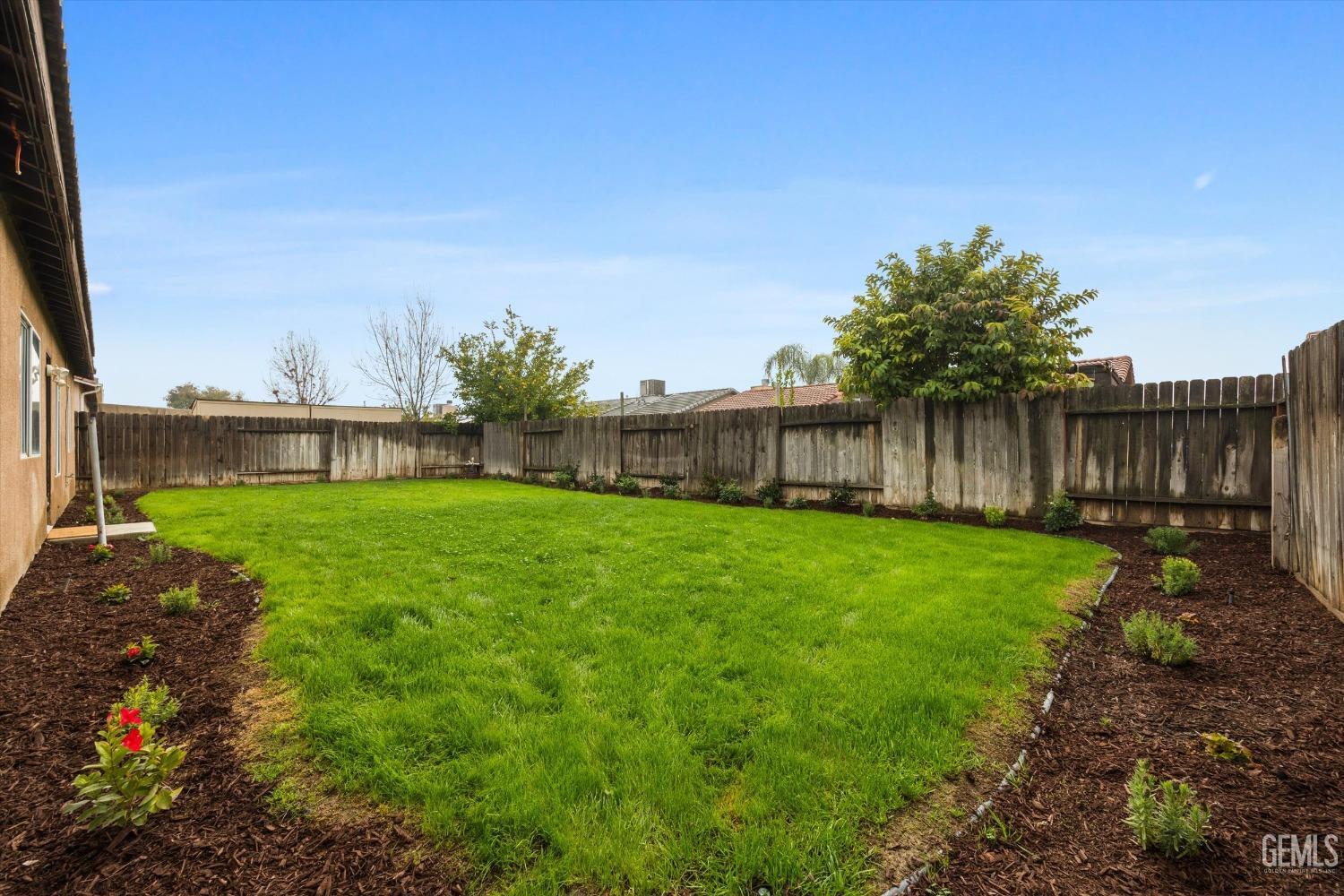 Undisclosed Address Bakersfield, CA 93307 - Photo 32 of 35 a view of a house with backyard and a sitting area
