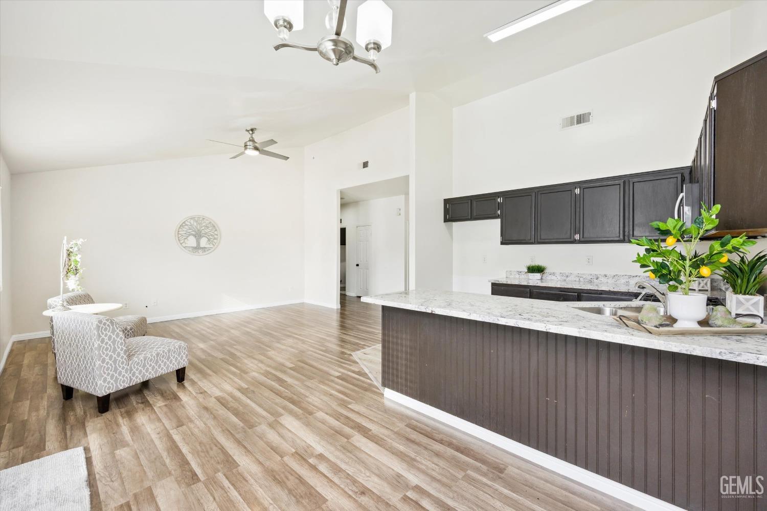 Undisclosed Address Bakersfield, CA 93307 - Photo 10 of 35 a kitchen with a sink and refrigerator