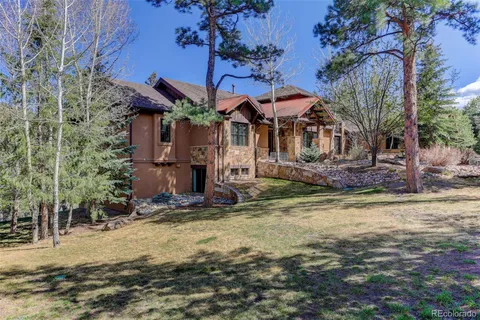 a view of a house with a small yard