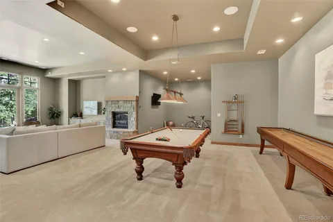 a room with furniture and a pool table