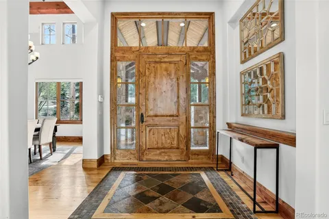 a living room with a furniture and a fireplace