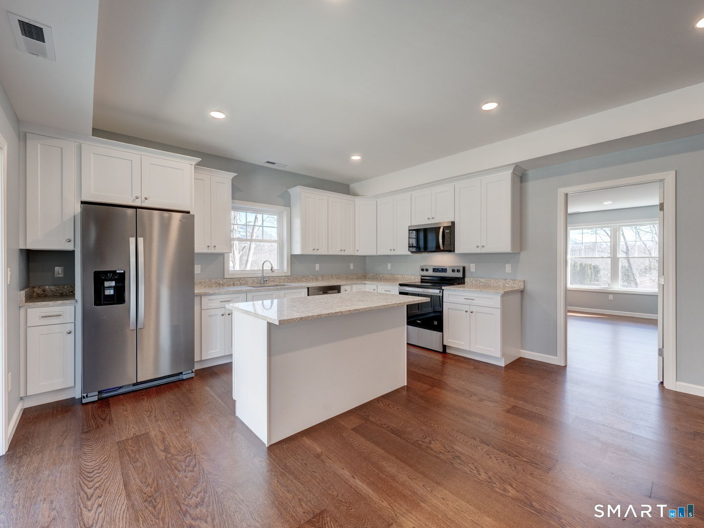 28 Goodell Road Stafford, CT 06076 - Photo 13 of 40 a kitchen with white cabinets and stainless steel appliances
