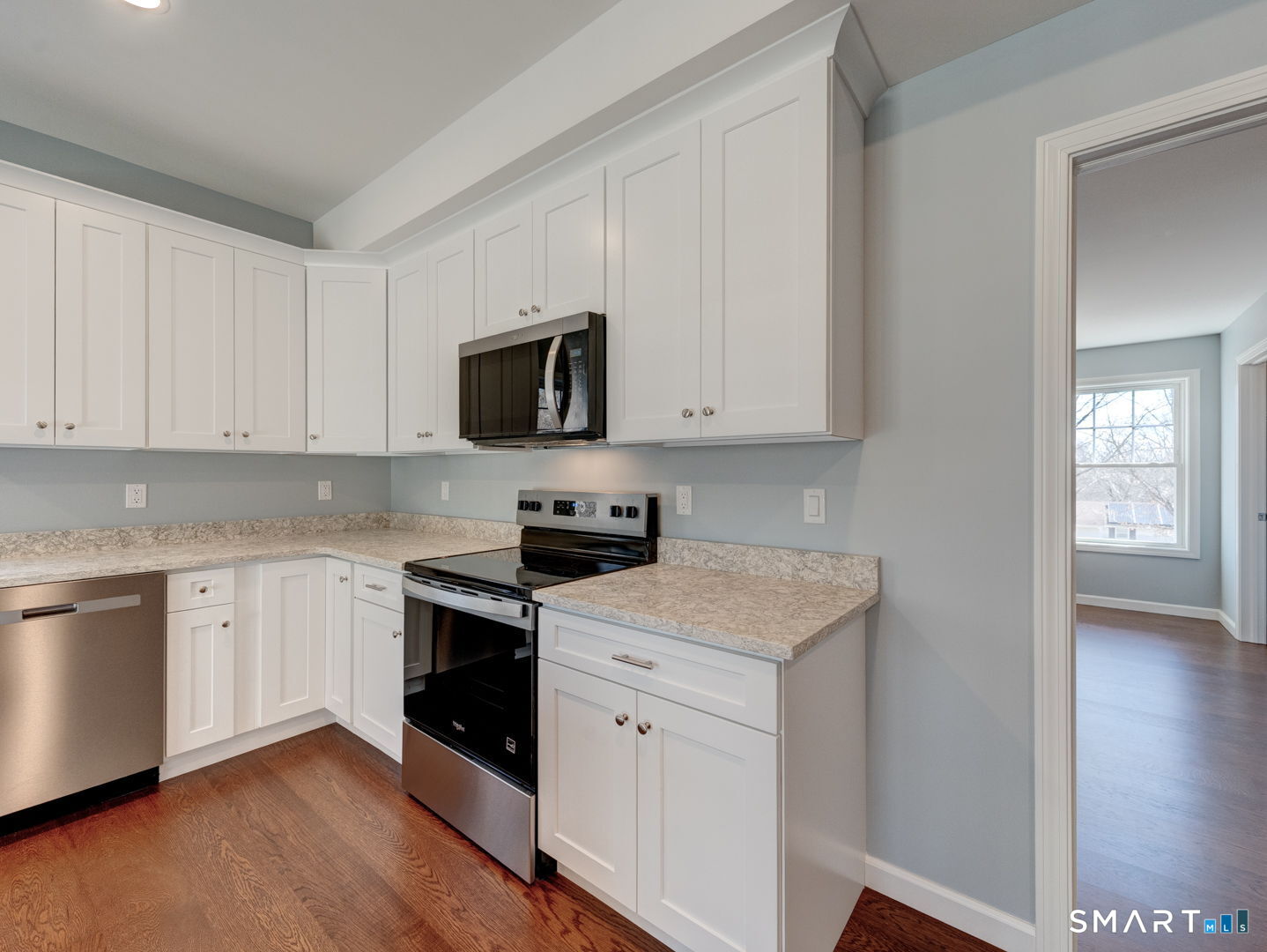 28 Goodell Road Stafford, CT 06076 - Photo 18 of 40 a kitchen with white cabinets stainless steel appliances and sink
