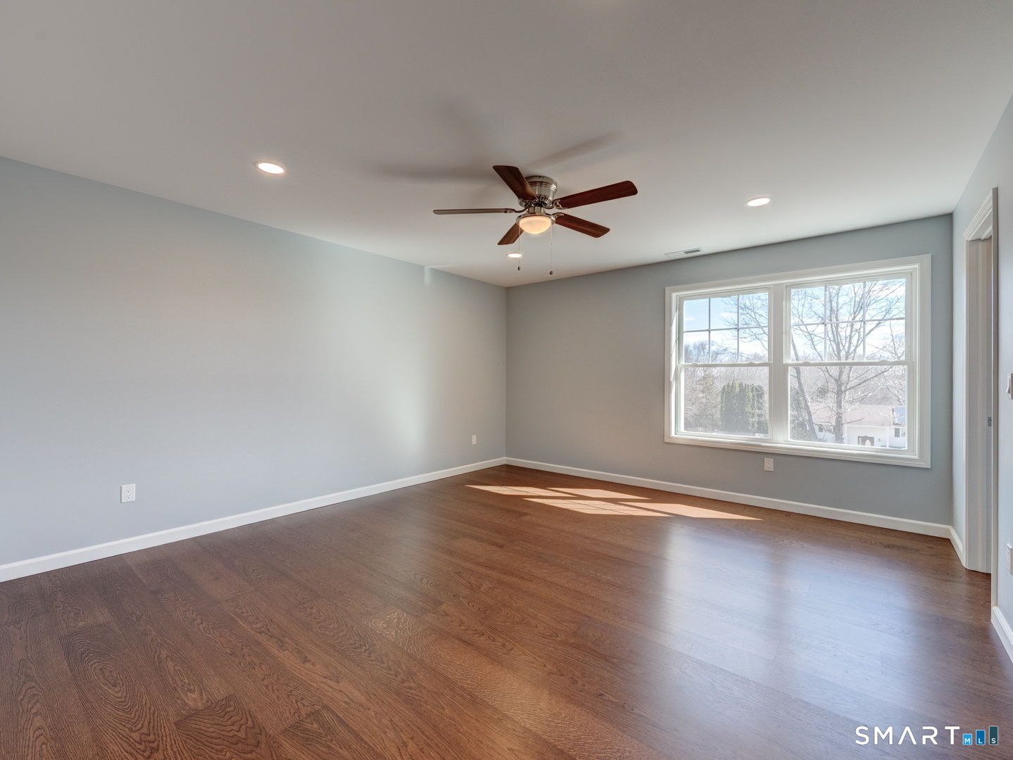 28 Goodell Road Stafford, CT 06076 - Photo 20 of 40 a view of an empty room with wooden floor and a window