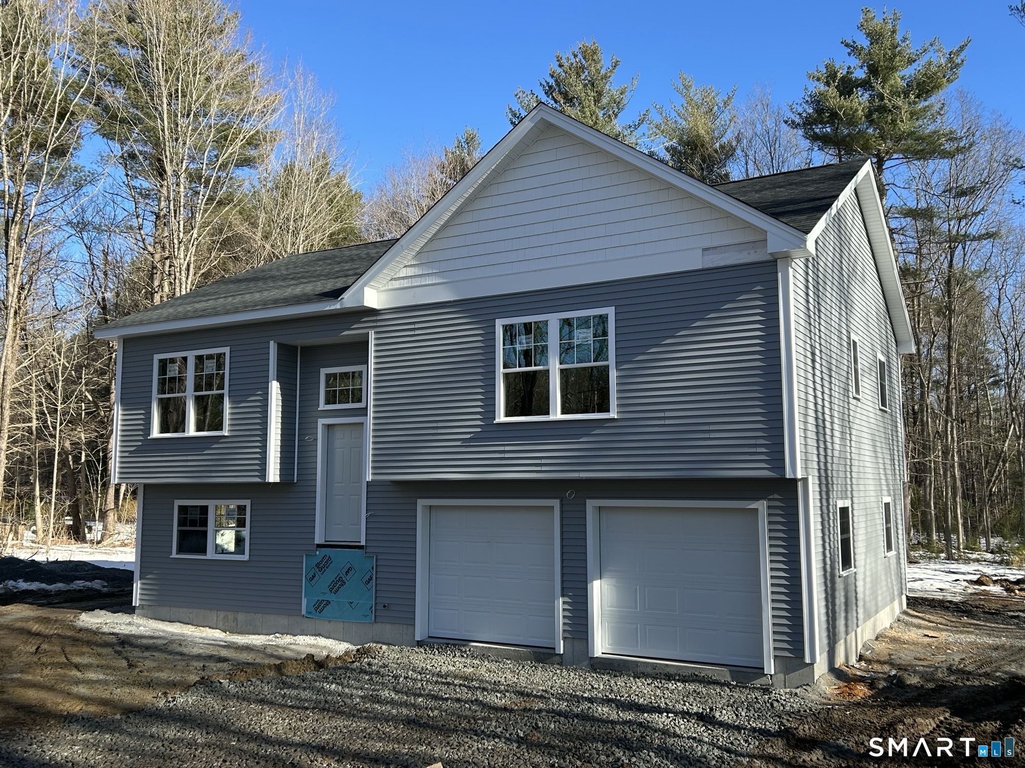 28 Goodell Road Stafford, CT 06076 - Photo 2 of 40 a front view of a house with a yard