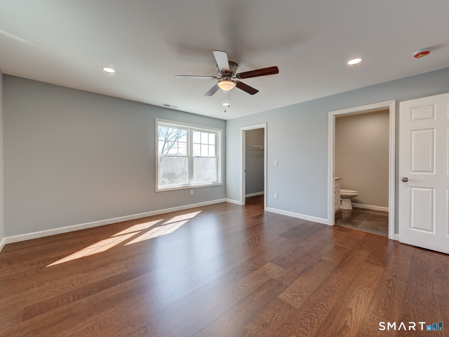 28 Goodell Road Stafford, CT 06076 - Photo 21 of 40 a view of an empty room with window and wooden floor