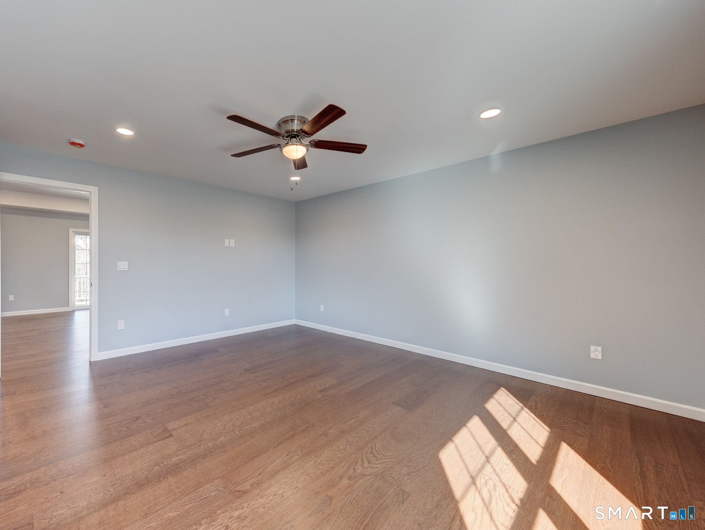 28 Goodell Road Stafford, CT 06076 - Photo 23 of 40 an empty room with wooden floor and windows