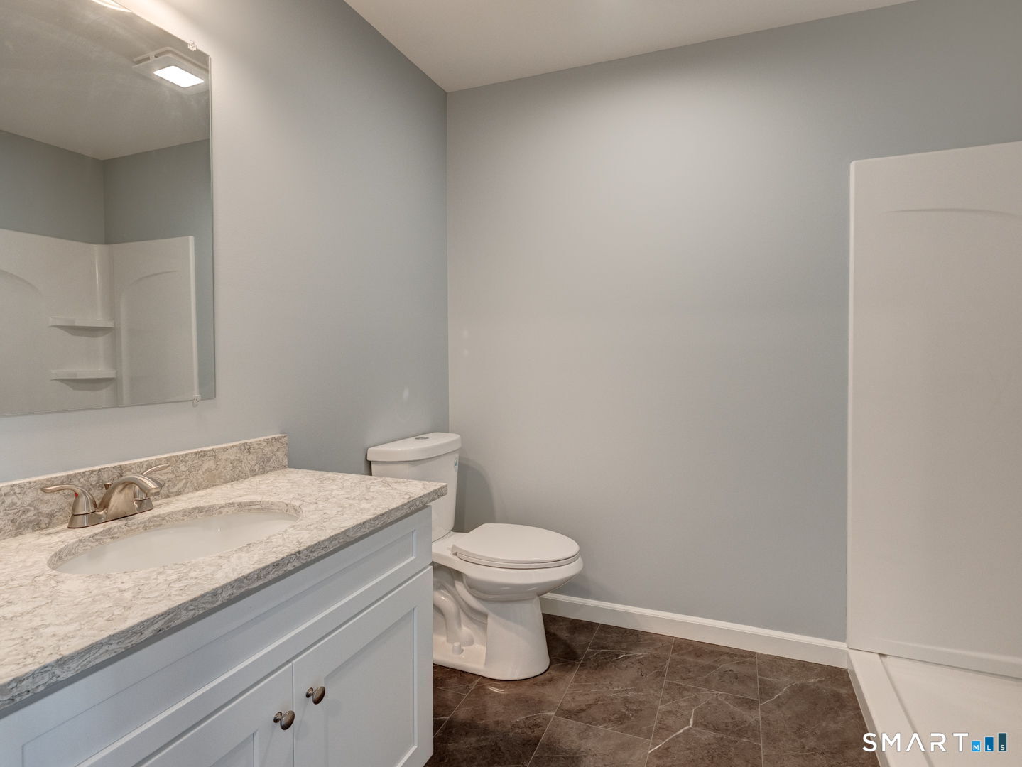 28 Goodell Road Stafford, CT 06076 - Photo 24 of 40 a bathroom with a granite countertop toilet and a sink